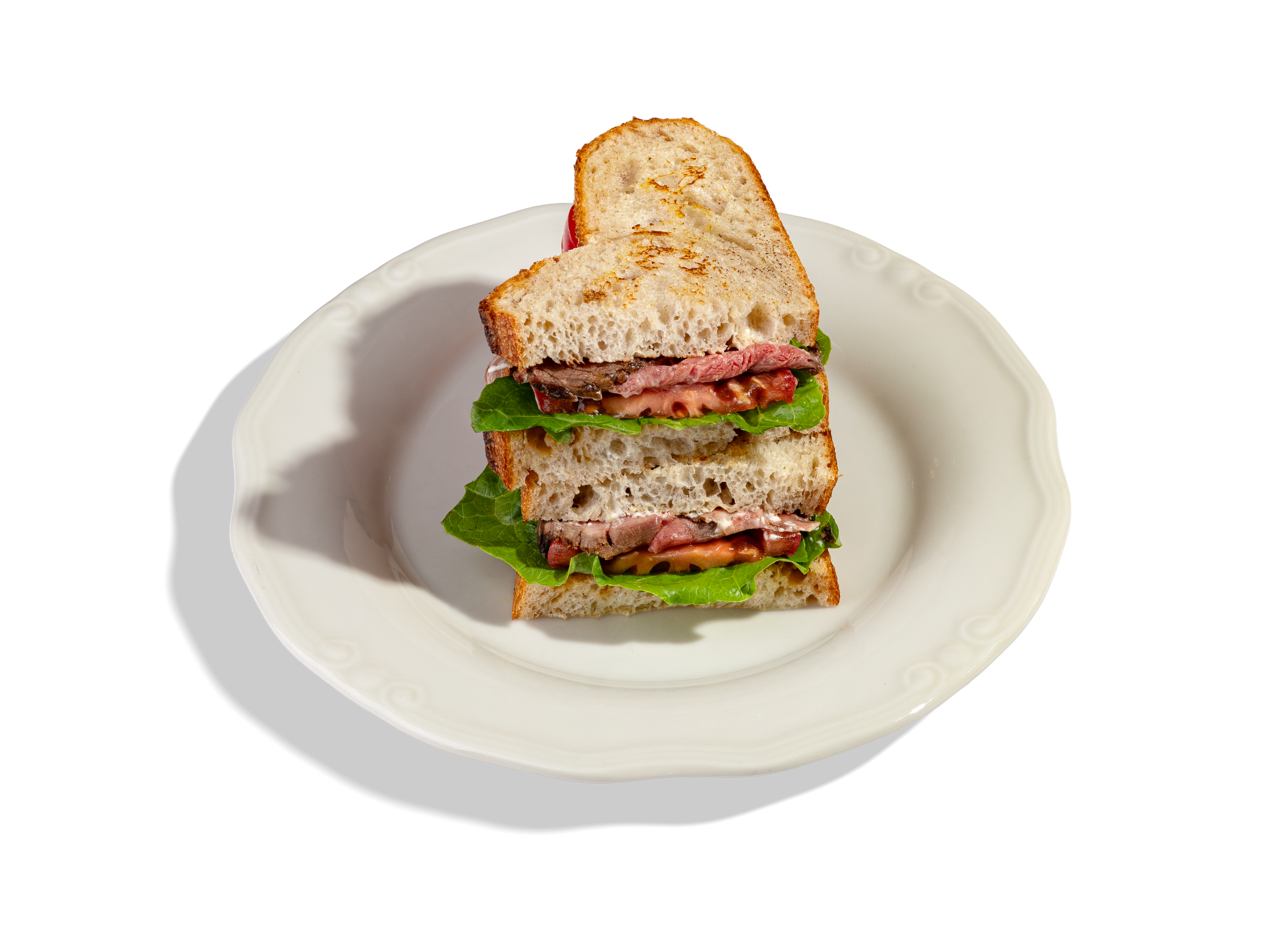 СЭНДВИЧ С РОСТБИФОМ И ТРЮФЕЛЬНЫМ МАСЛОМ — 850Р. Хлеб Тартин собственного производства, с ростбифом, свежими томатами, салатом романо, соусом тонато и медово - горчичной заправкой.