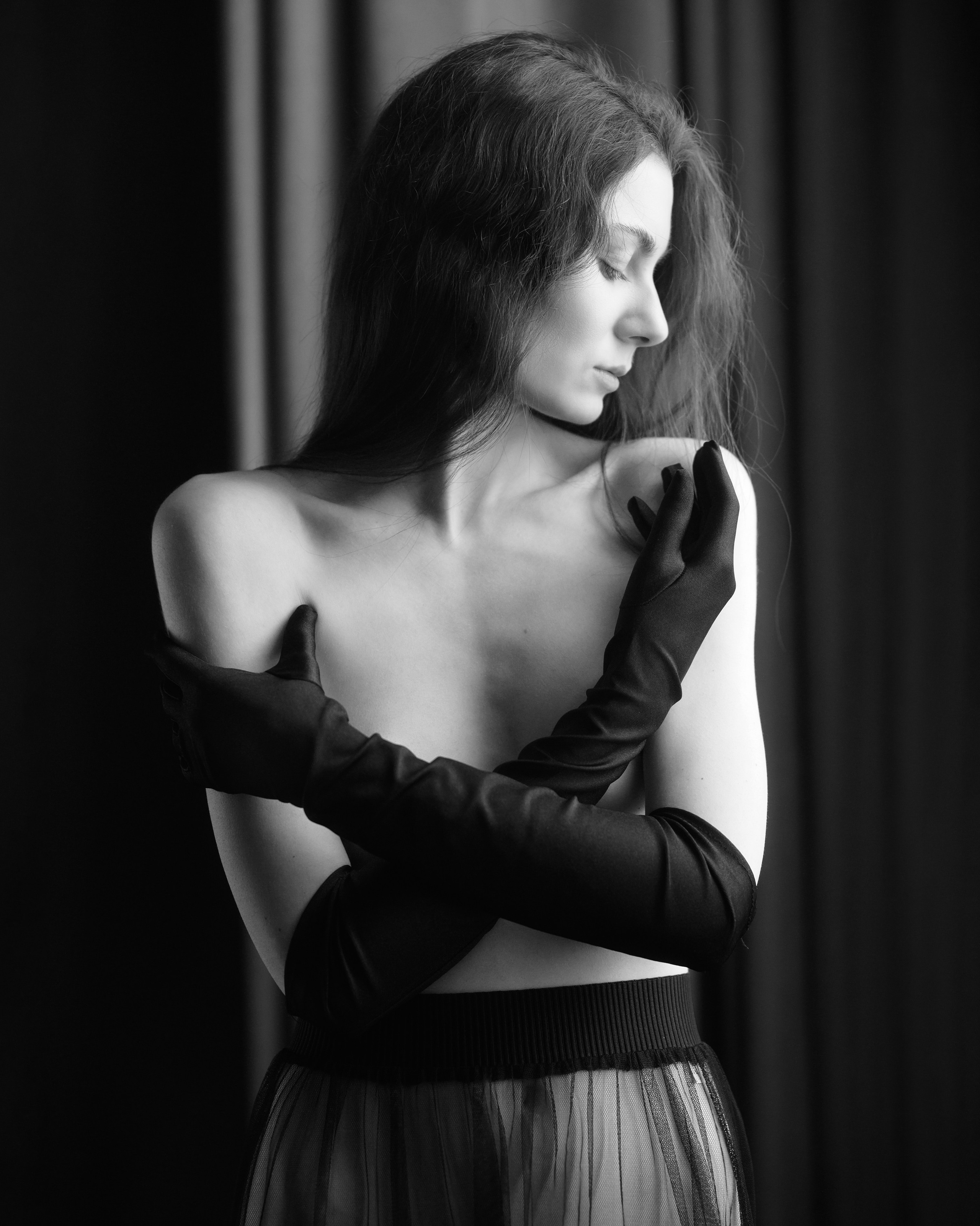 A series of creative photos taken in the studio. The photos are made in the nude genre. Black and white photo