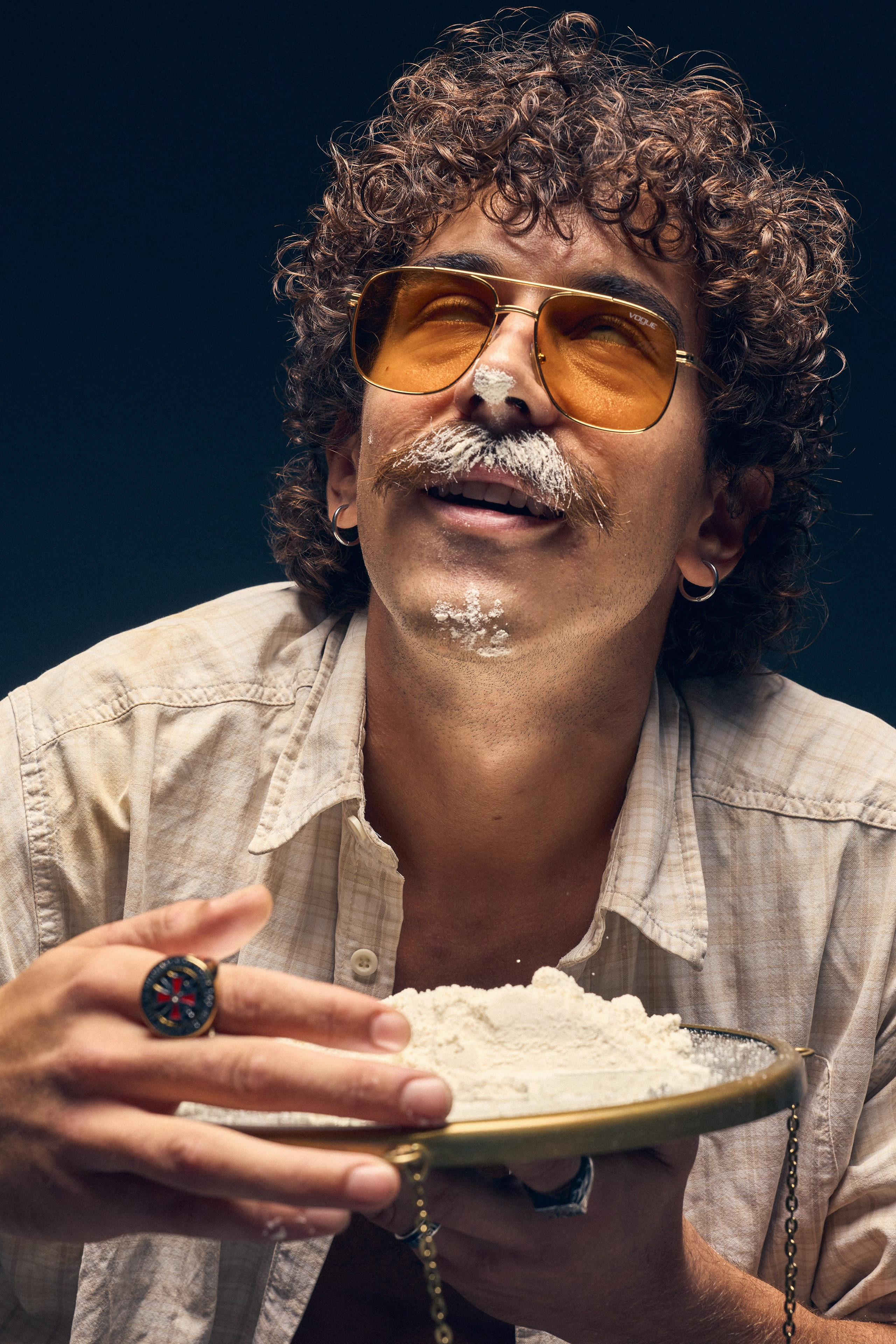 Man in sunglasses with mustache in conceptual portrait