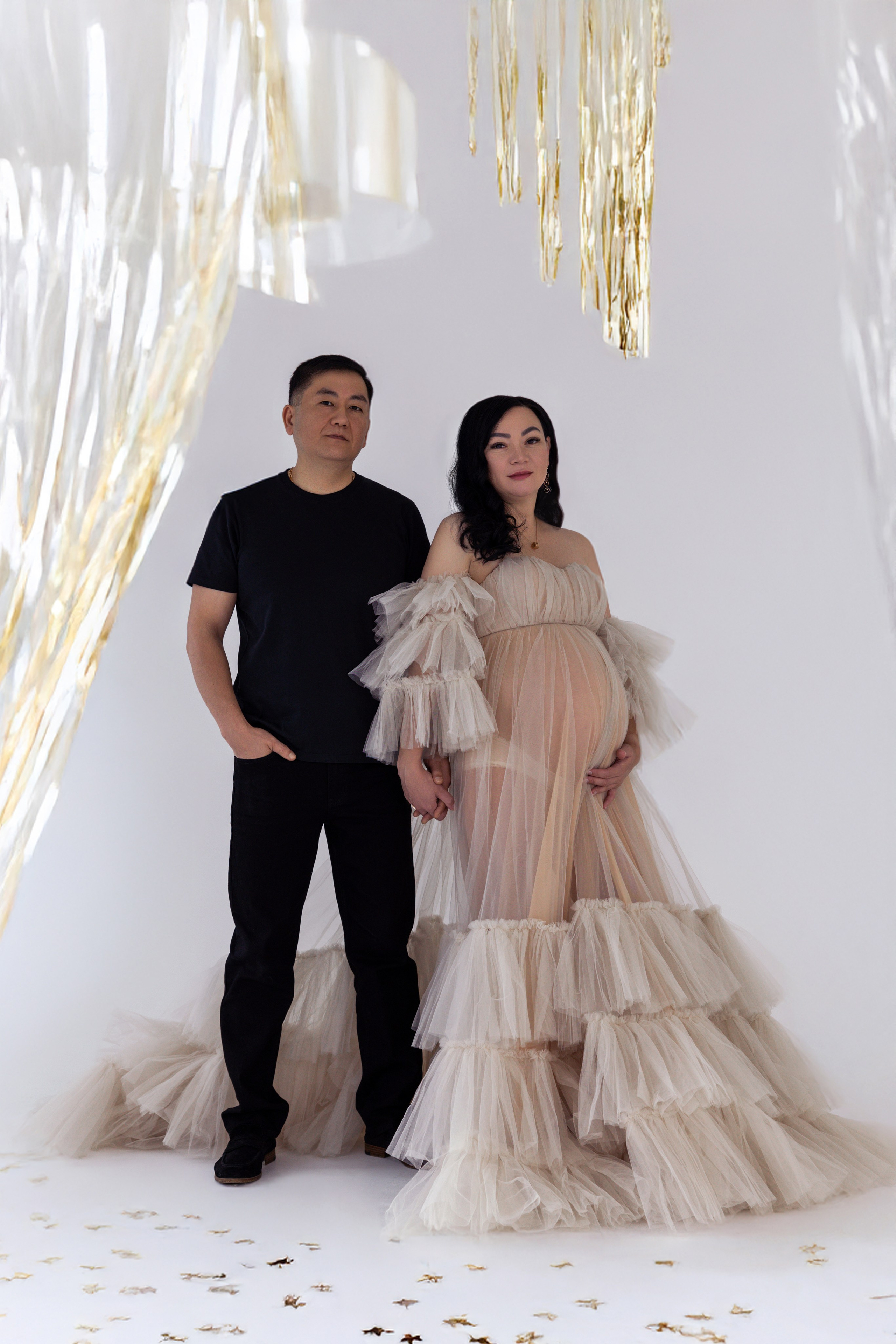 Pregnancy photo session with husband in studio