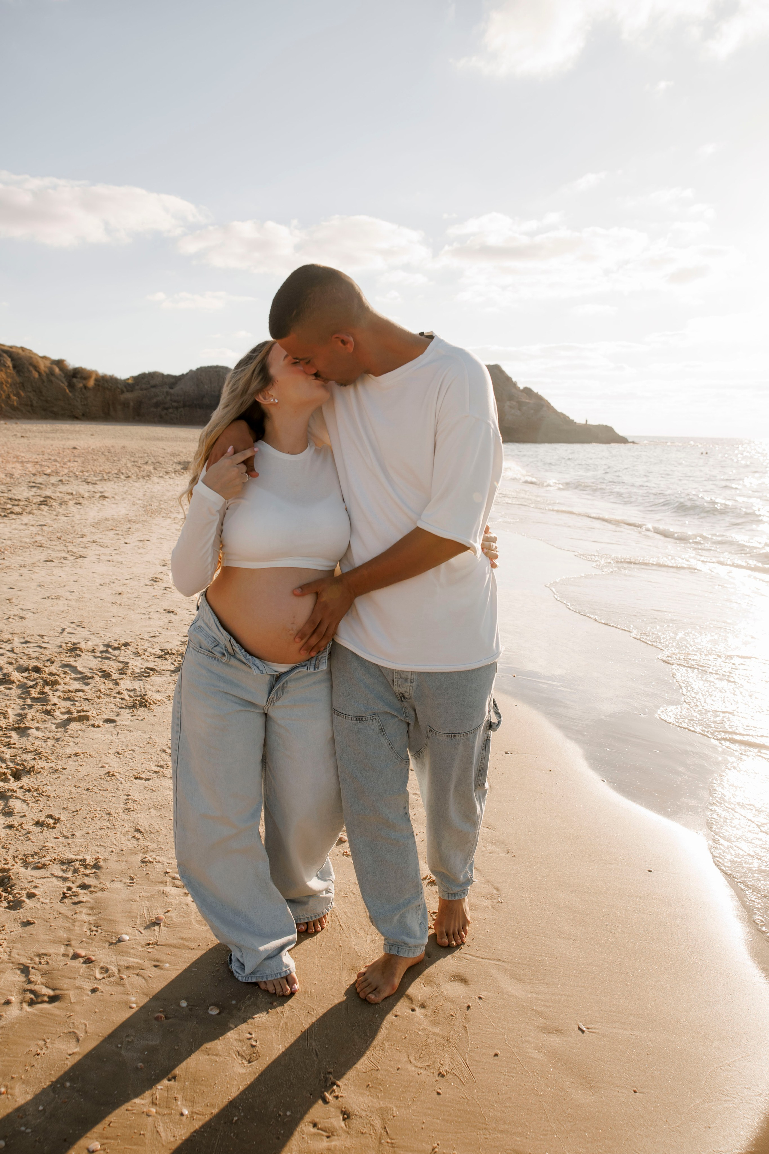 Pregnancy photoshoot near the sea. Wedding and family photographer