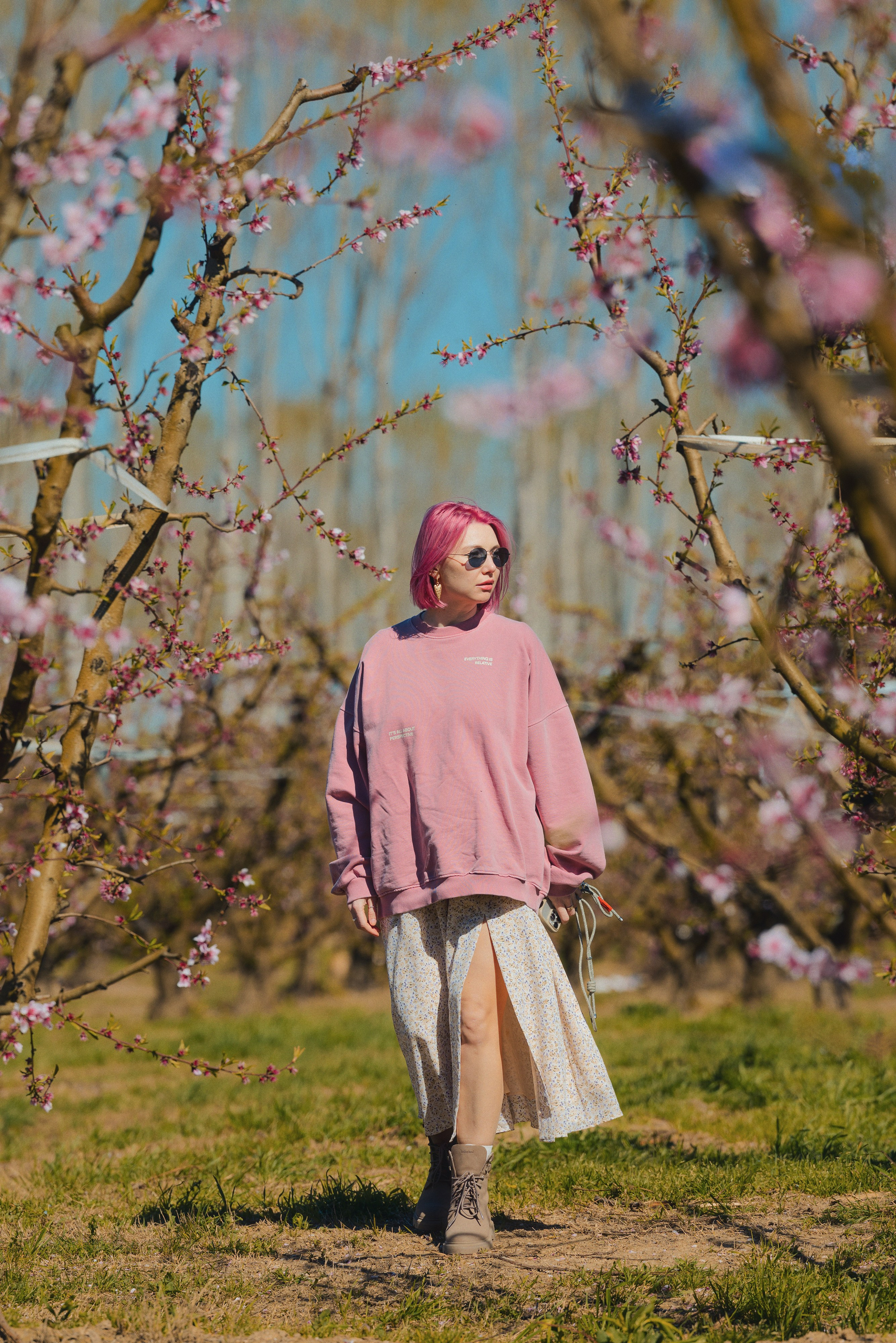 Spring portrait of a woman in a blooming park in Barcelona, outdoor photography