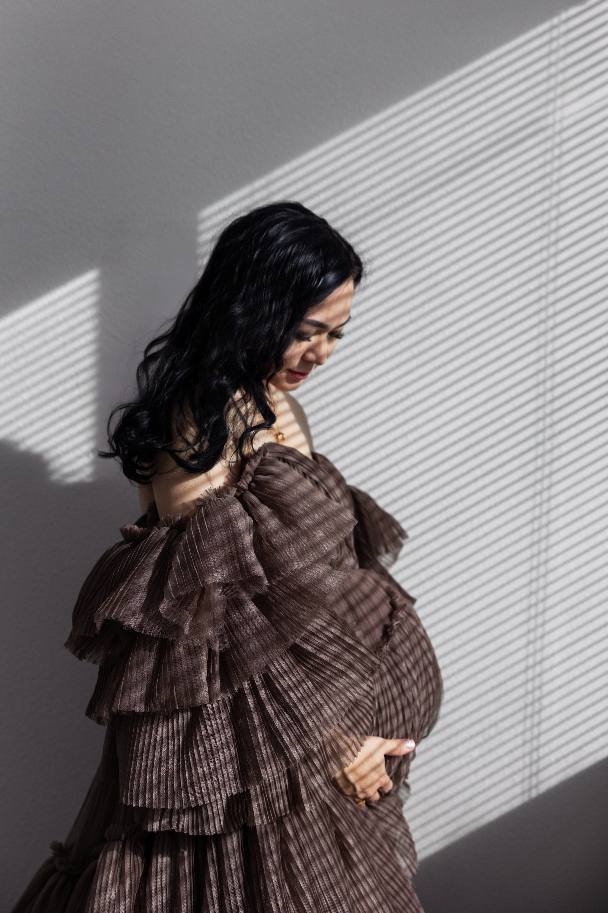 Pregnancy photo session with husband in studio