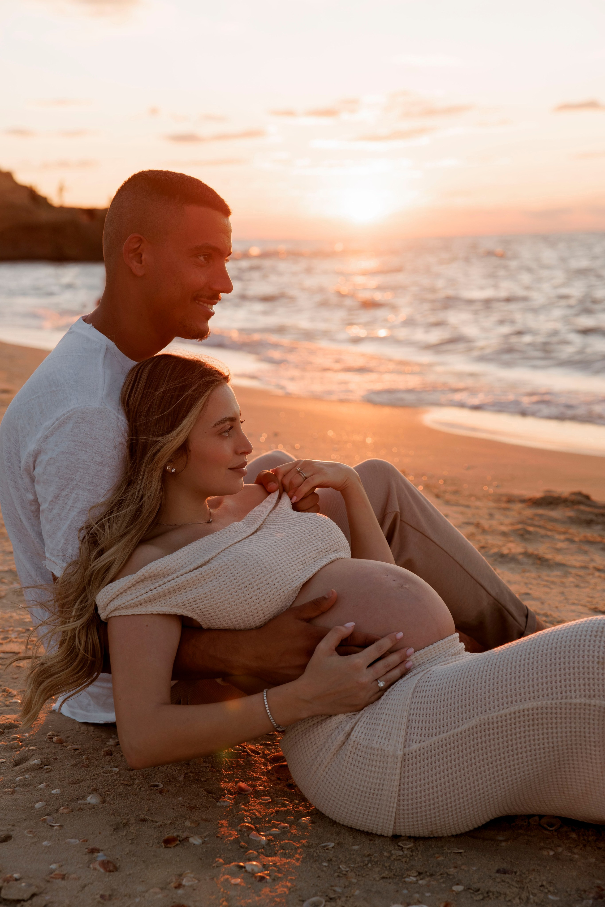 Pregnancy photoshoot near the sea. Wedding and family photographer