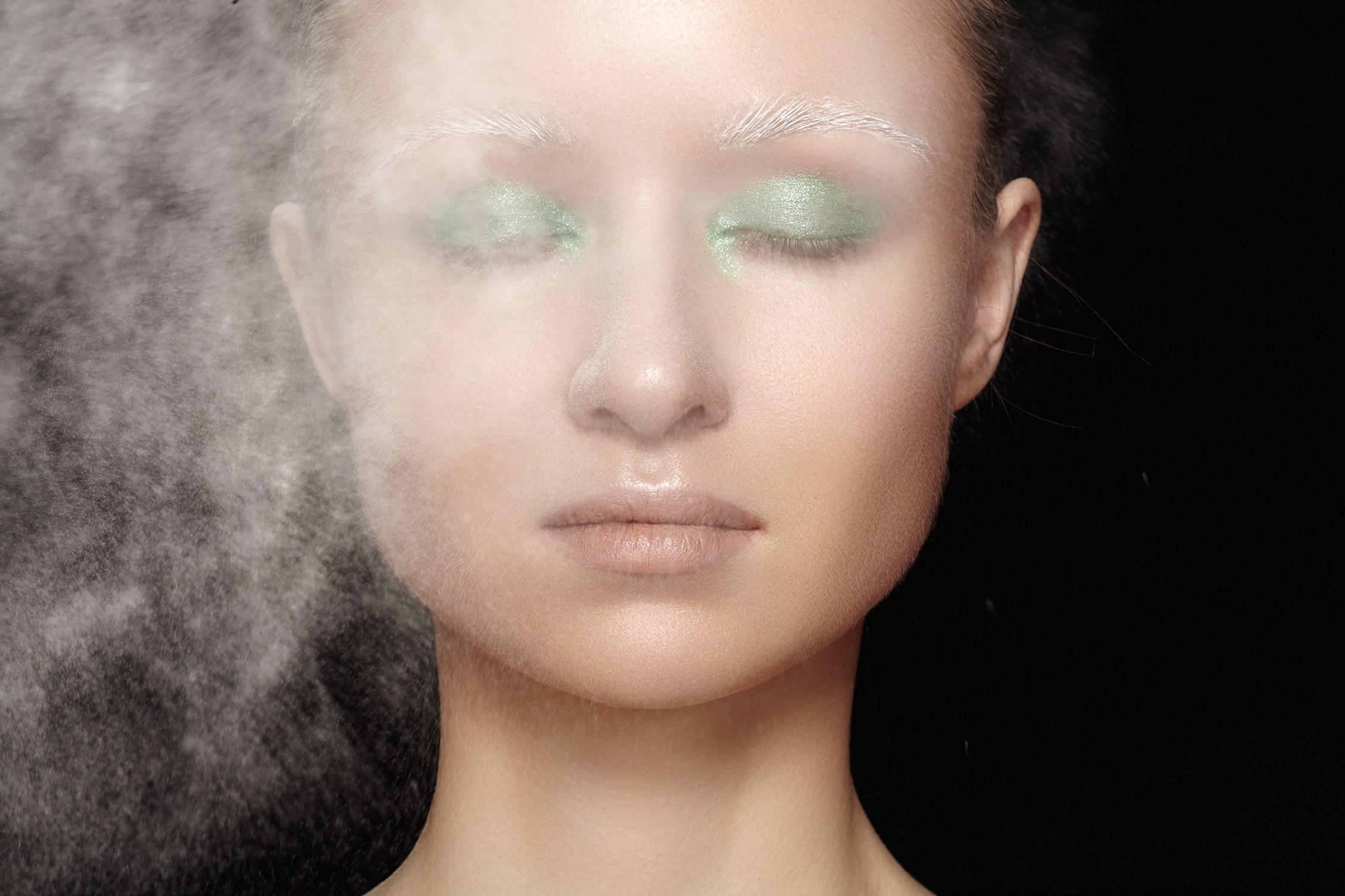 Modern fashion beauty portrait with powder mist