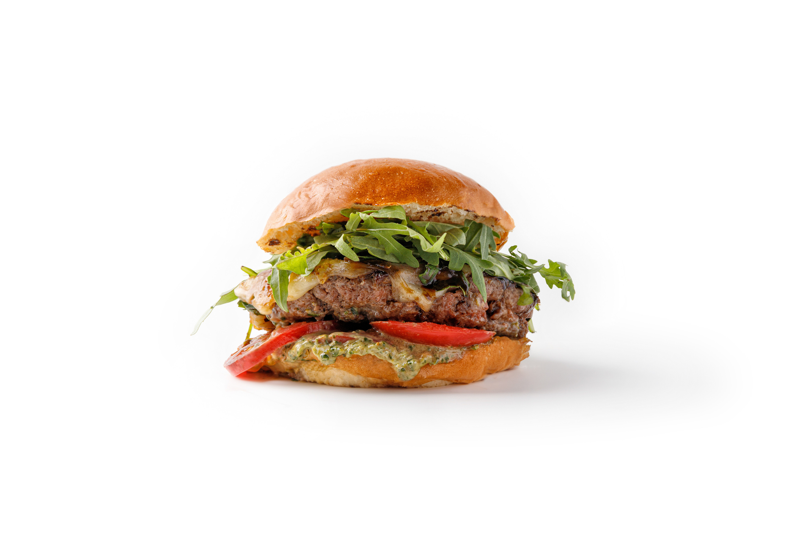 Фуд-фотография под островку бургер на белом фоне