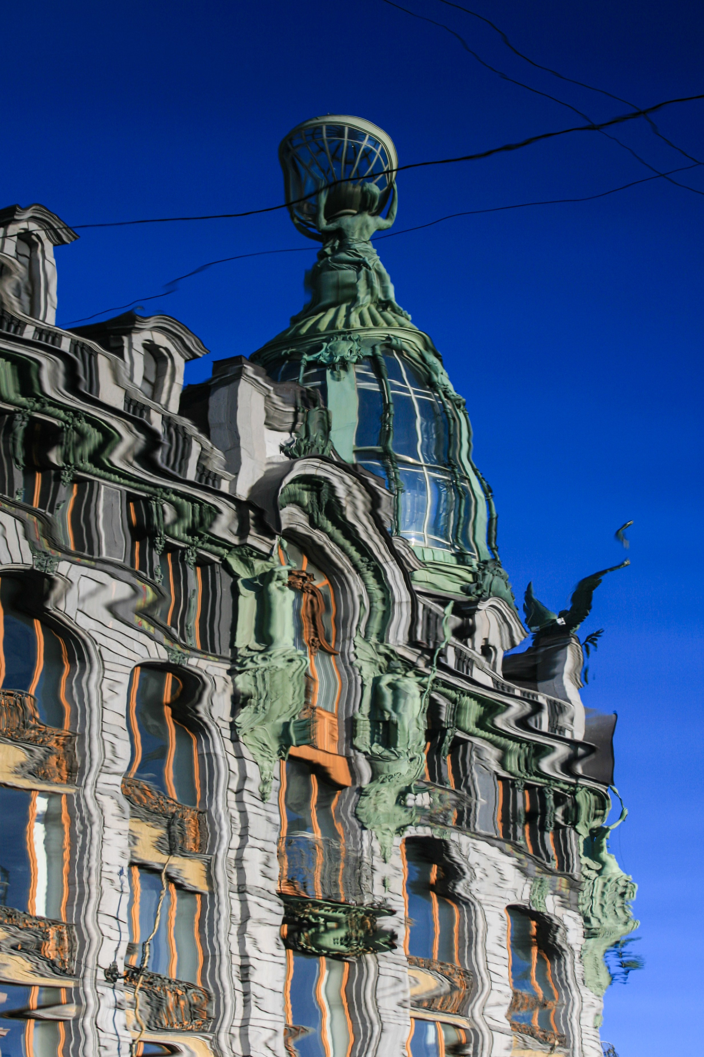 Reflections of Saint Petersburg landmarks Singer House, also widely known as the House of the Book