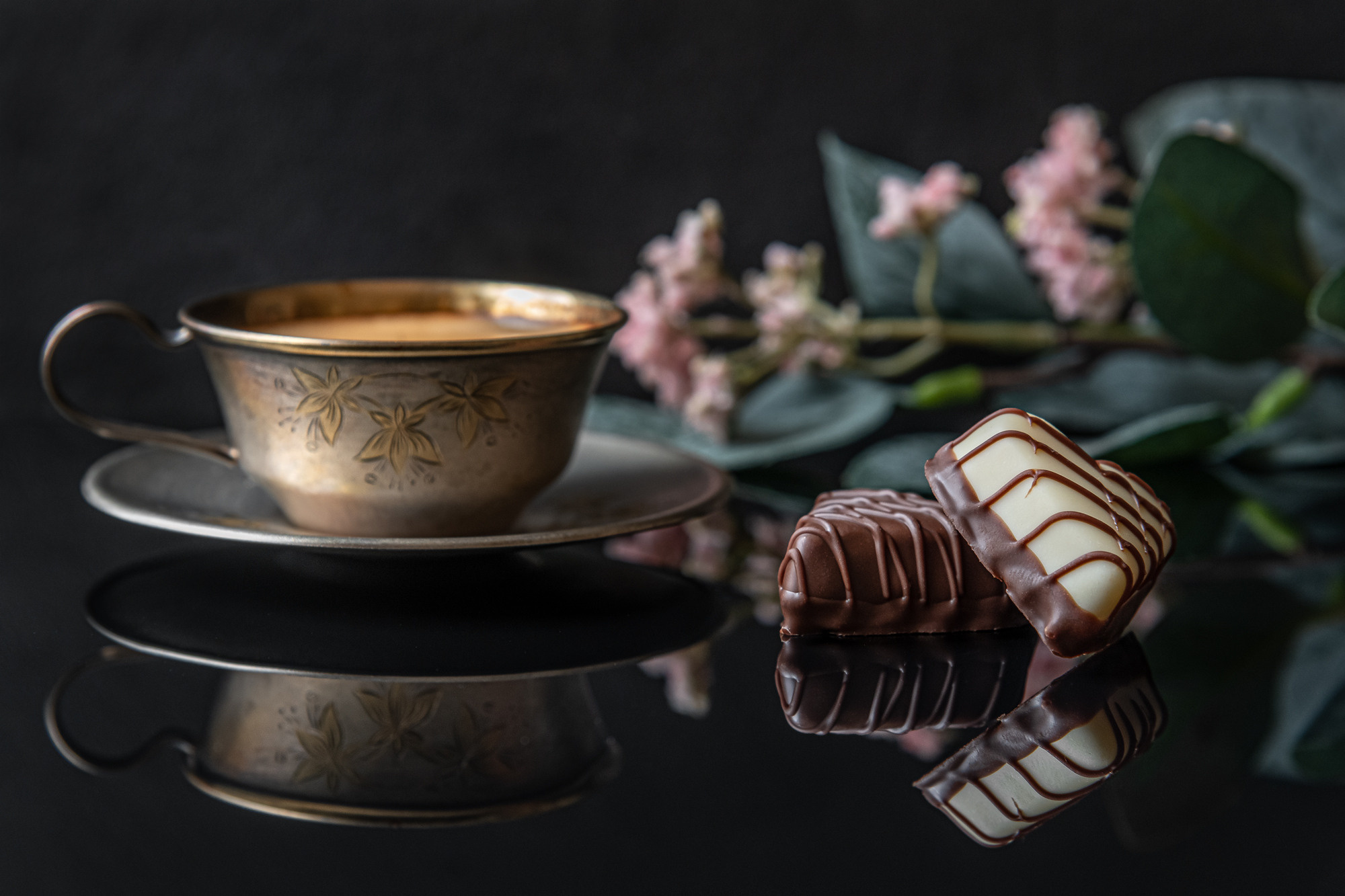 romantic still life a cup of coffee  and gourmet chocolate sweets