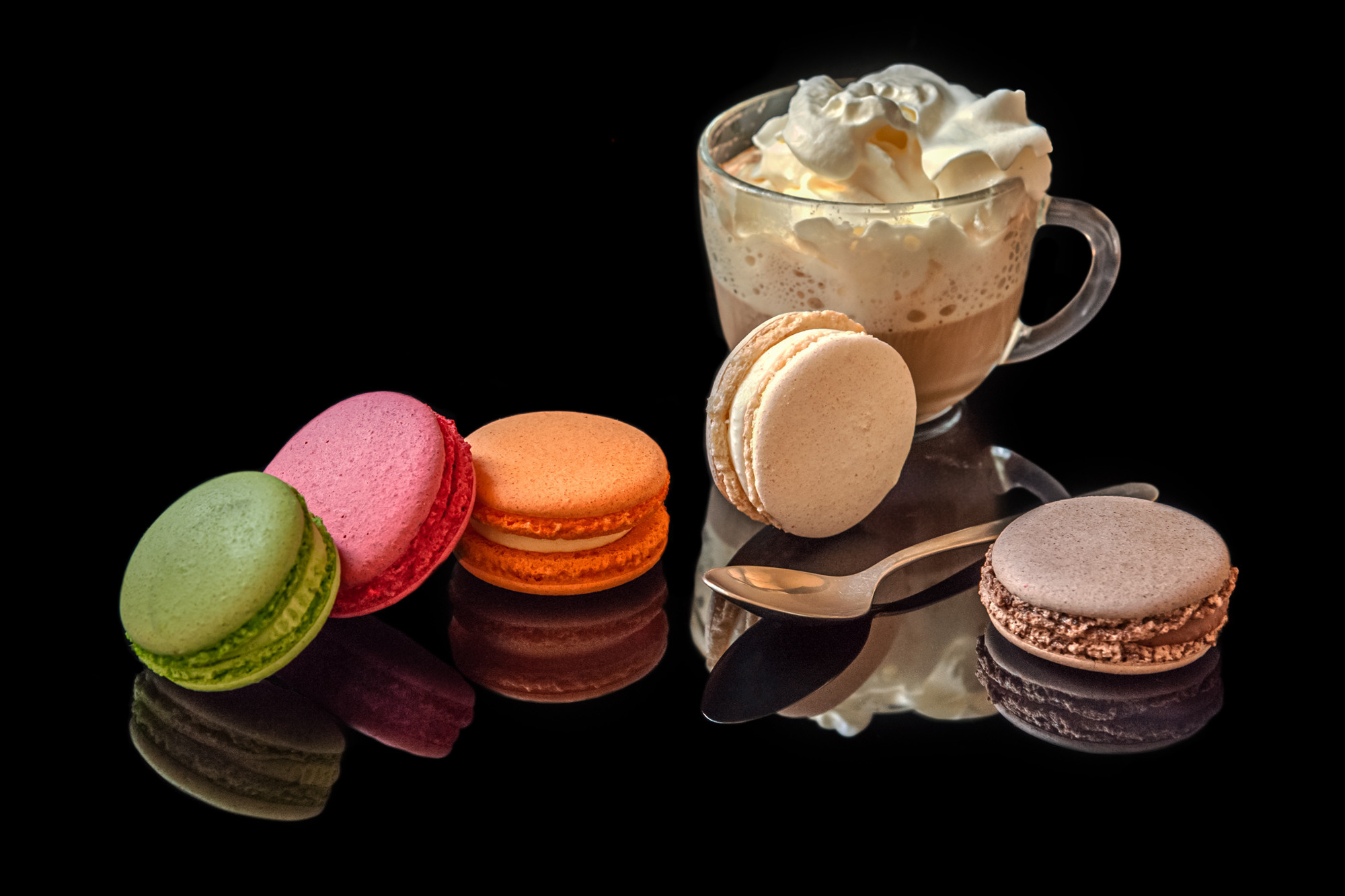 courmet coffee with ice cream and whipped cream and  and assorted macaroon cakes