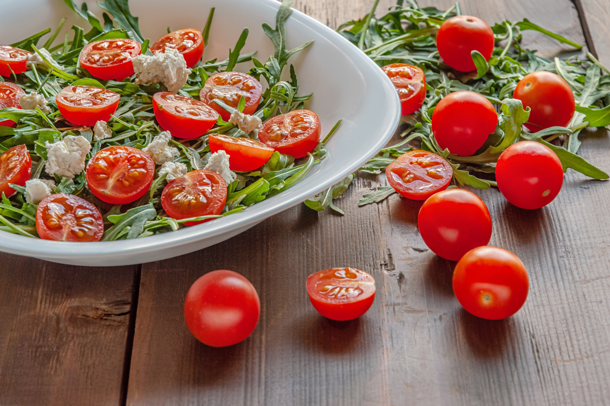 salad of arugula, cherry tomatoes and cottage cheese