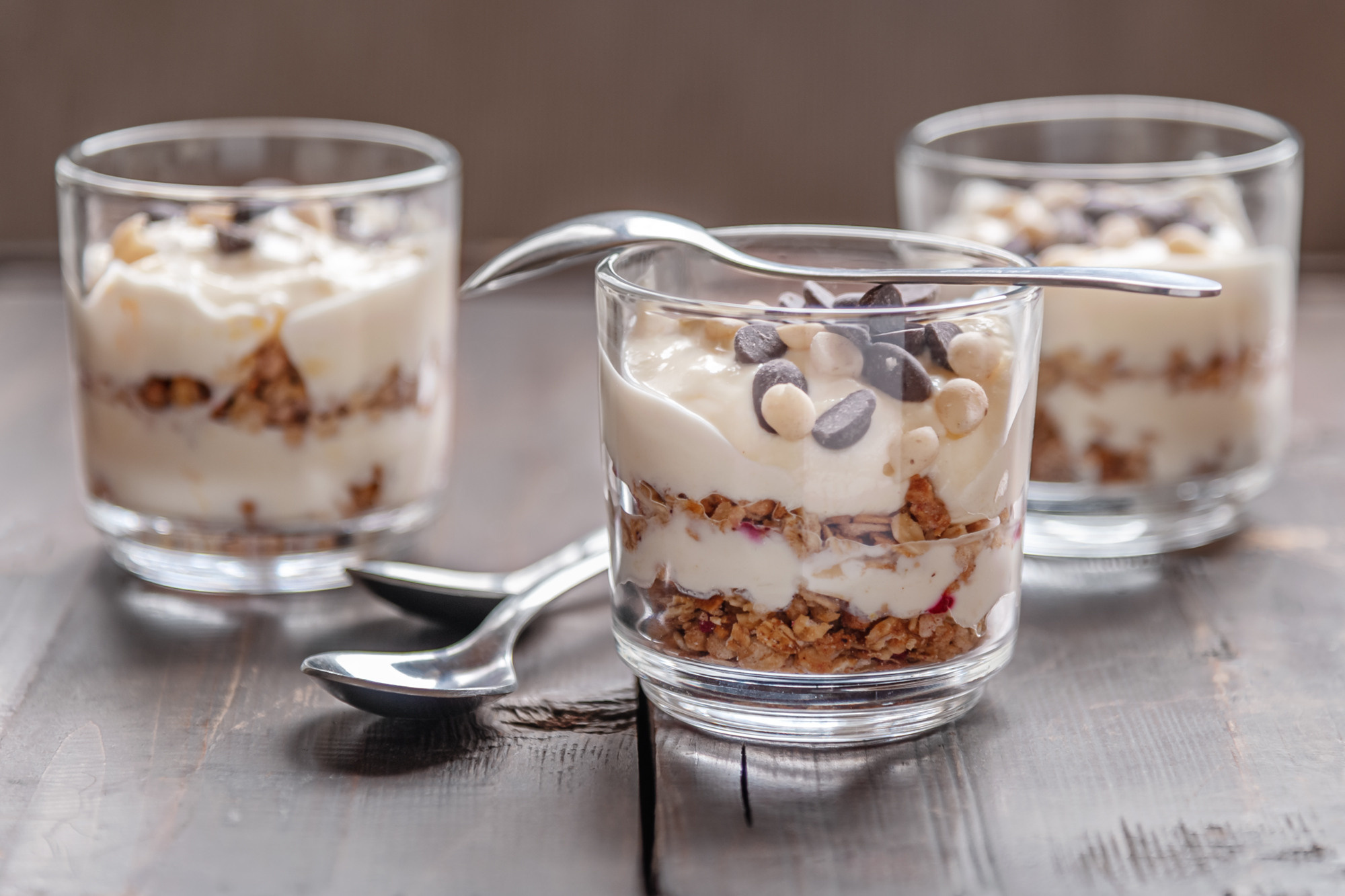 delicious layered dessert of muesli and fruit yogurt decorated with chocolate 