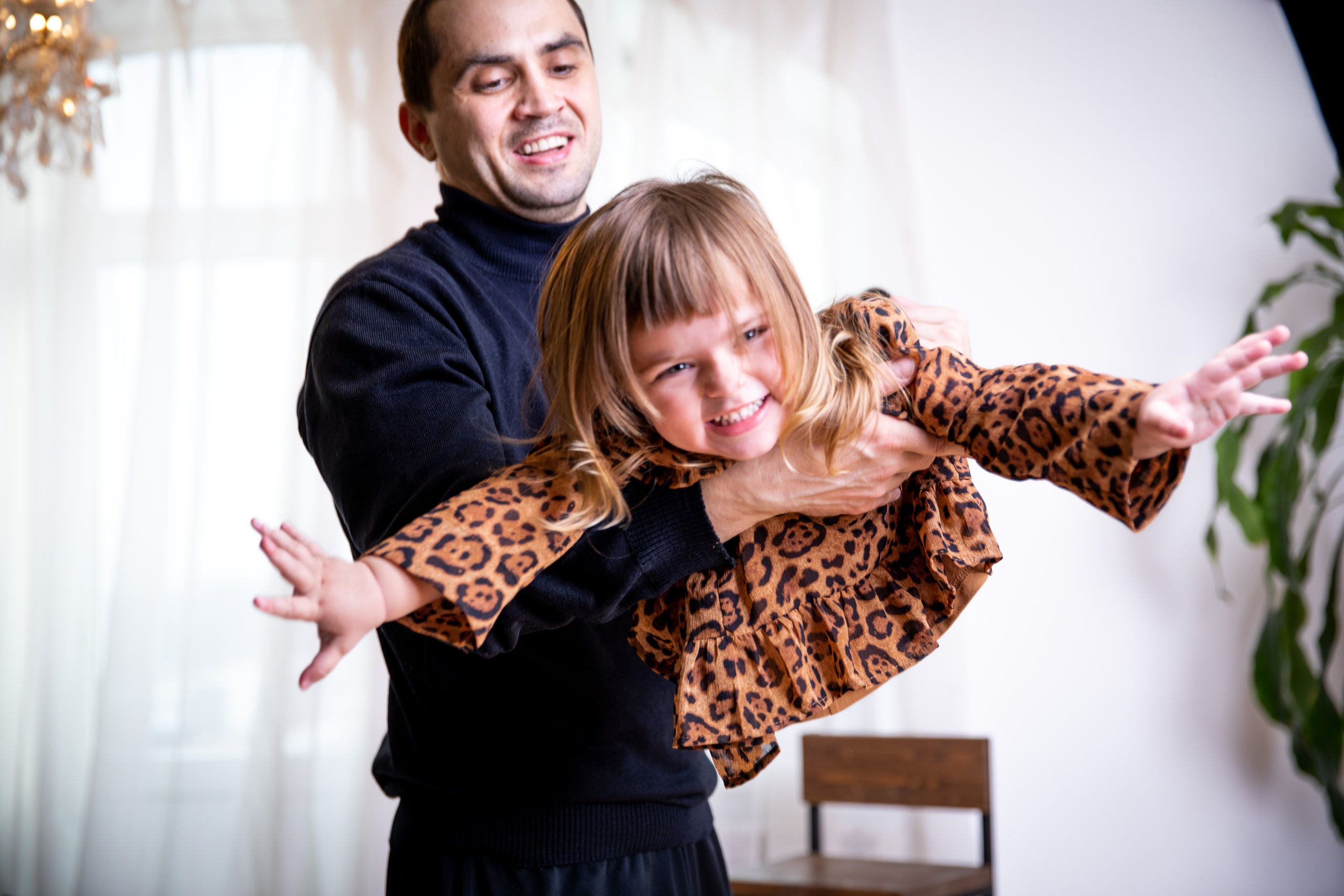 Father and daughter at a family photo shoot in the studio