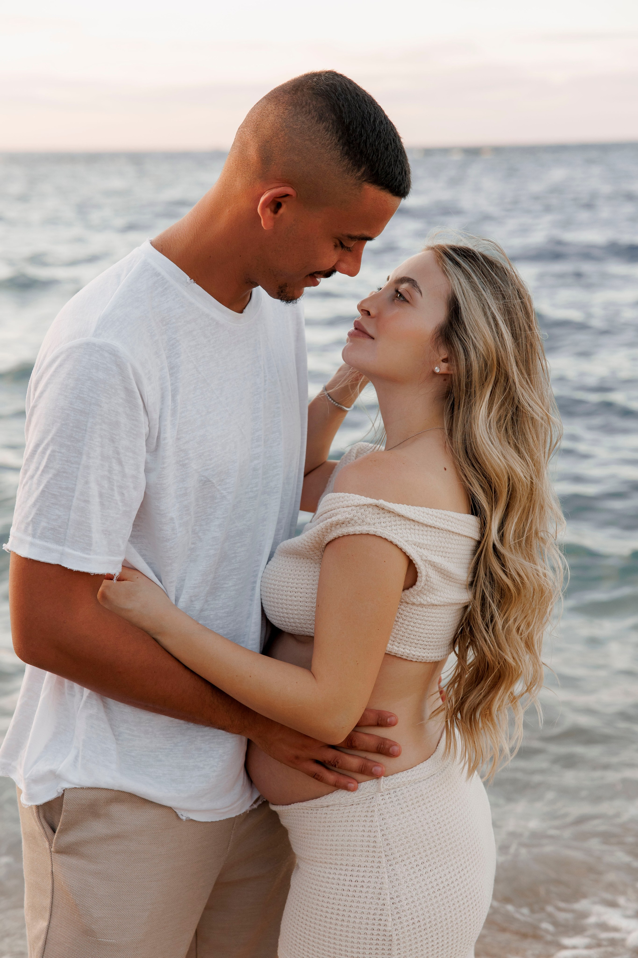 Pregnancy photoshoot near the sea. Wedding and family photographer
