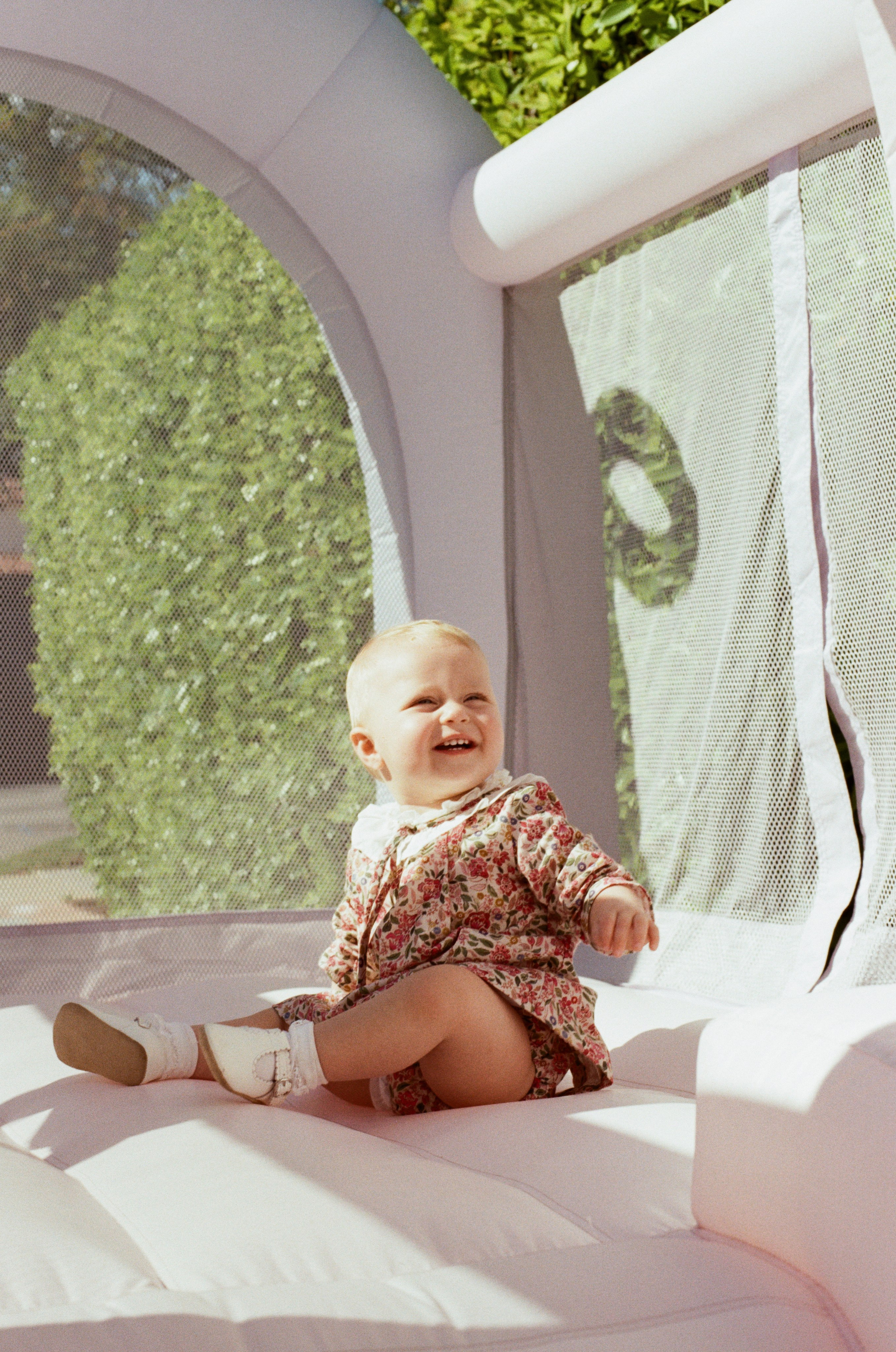 Baby girl inside of a bouncy house captured on film