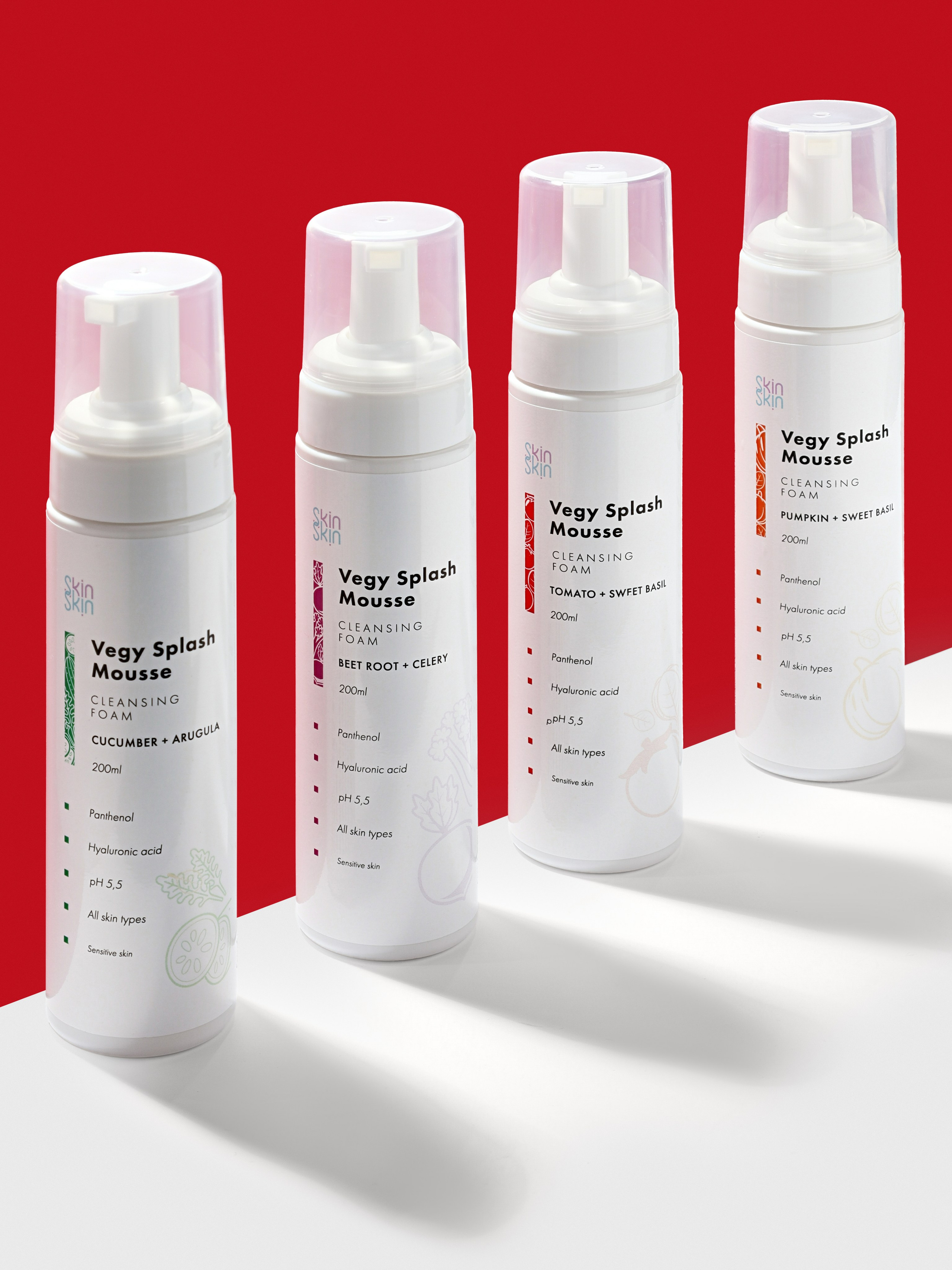 Групповое имиджевое фото четырех пенок для умывания на ярком цветном фоне для рекламы уходовой косметики.