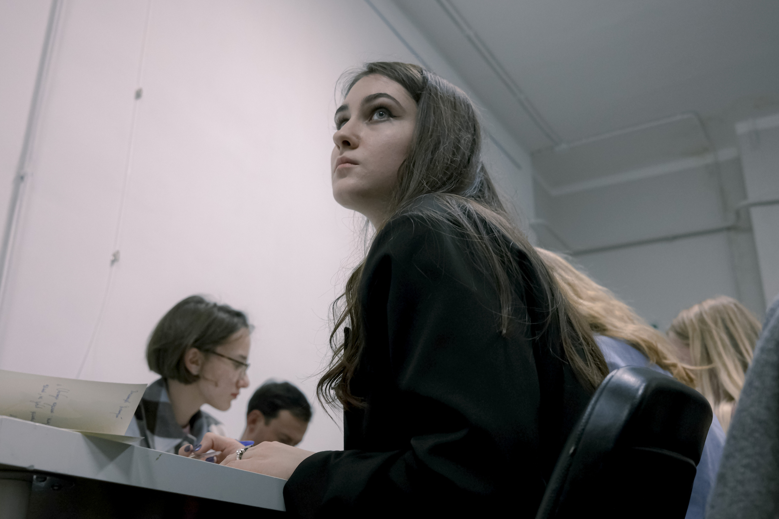 Signing postcards for political prisoners, September 2022. Photographer in Israel Alice Milchin