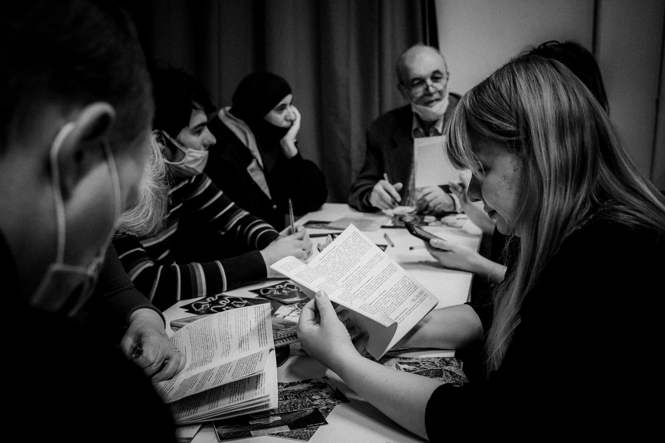 Signing postcards for political prisoners, February 2022. Photographer in Israel Alice Milchin