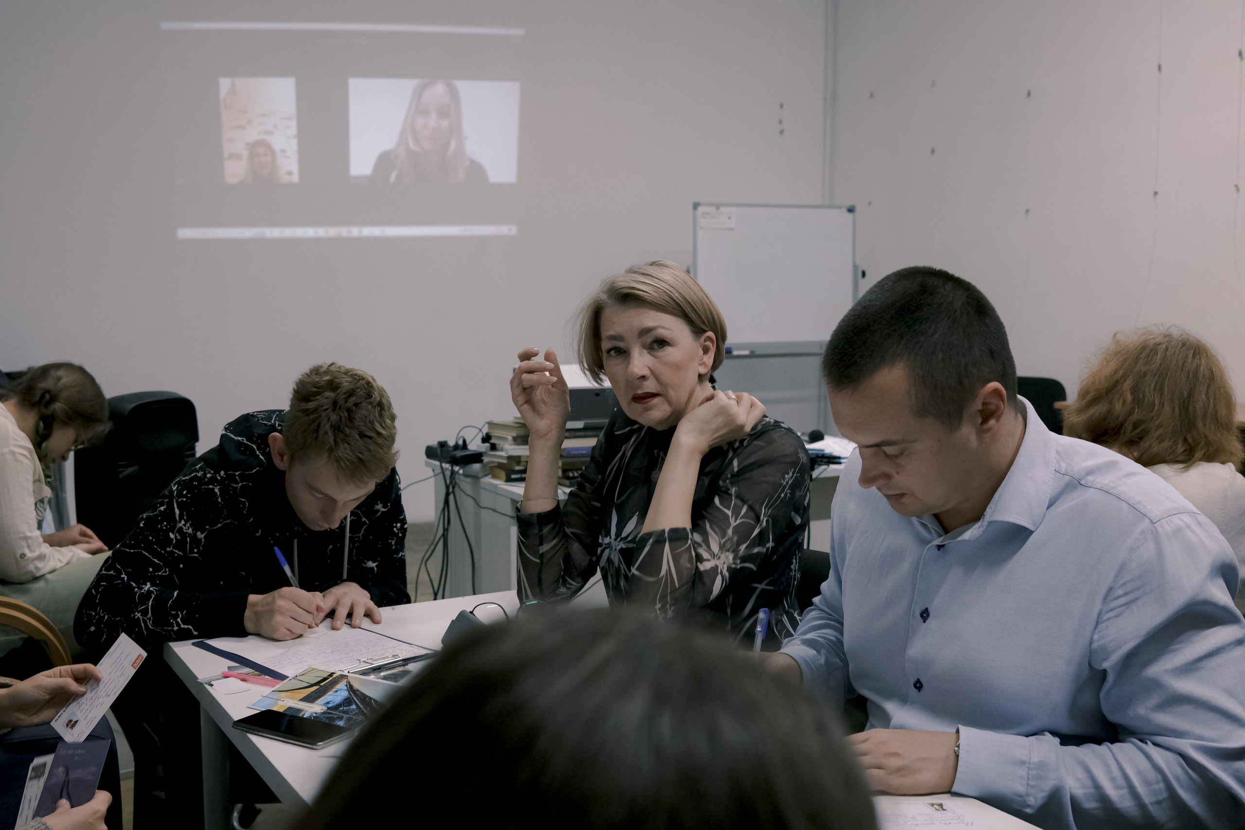 Signing postcards for political prisoners, September 2022. Photographer in Israel Alice Milchin
