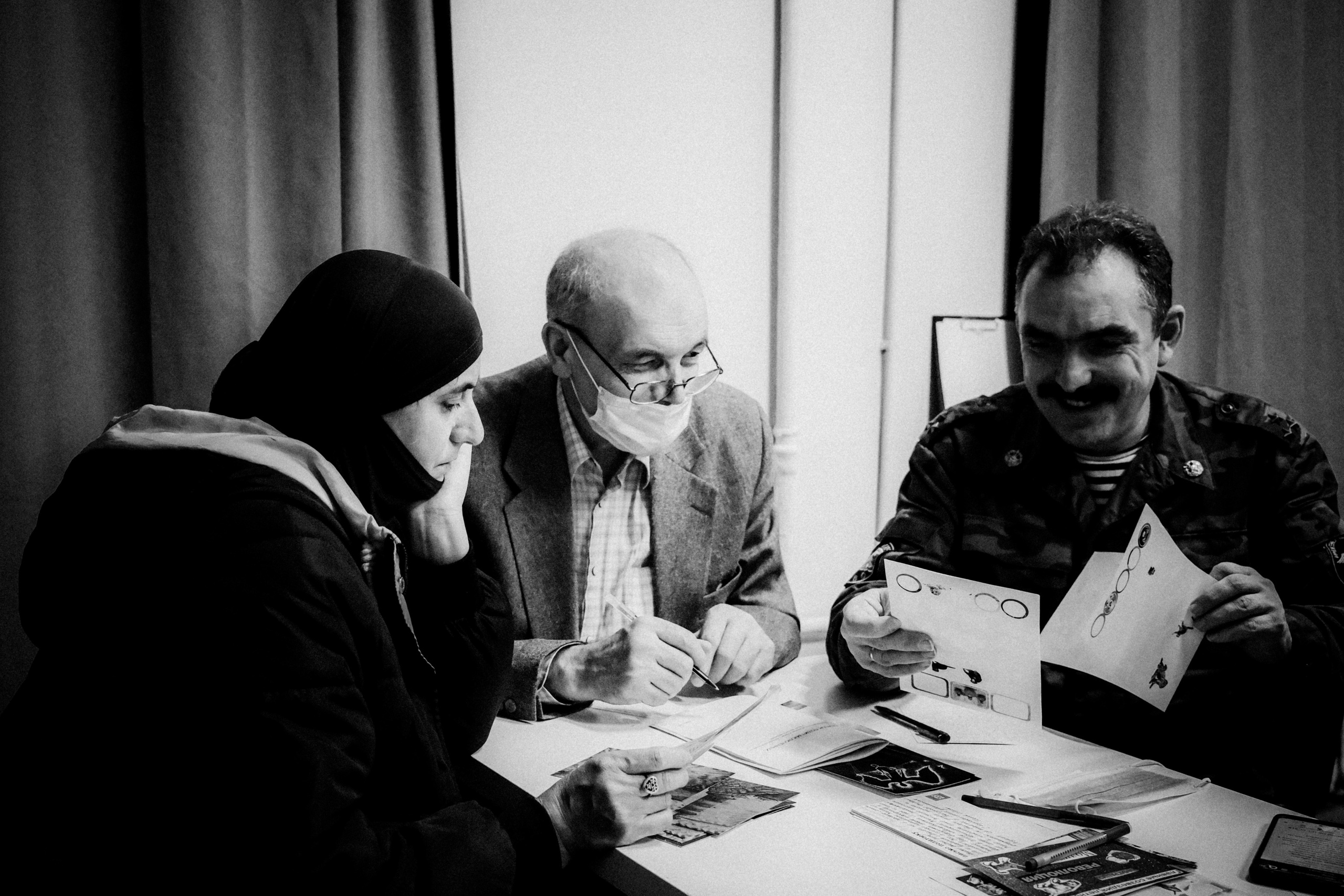 Signing postcards for political prisoners, February 2022. Photographer in Israel Alice Milchin