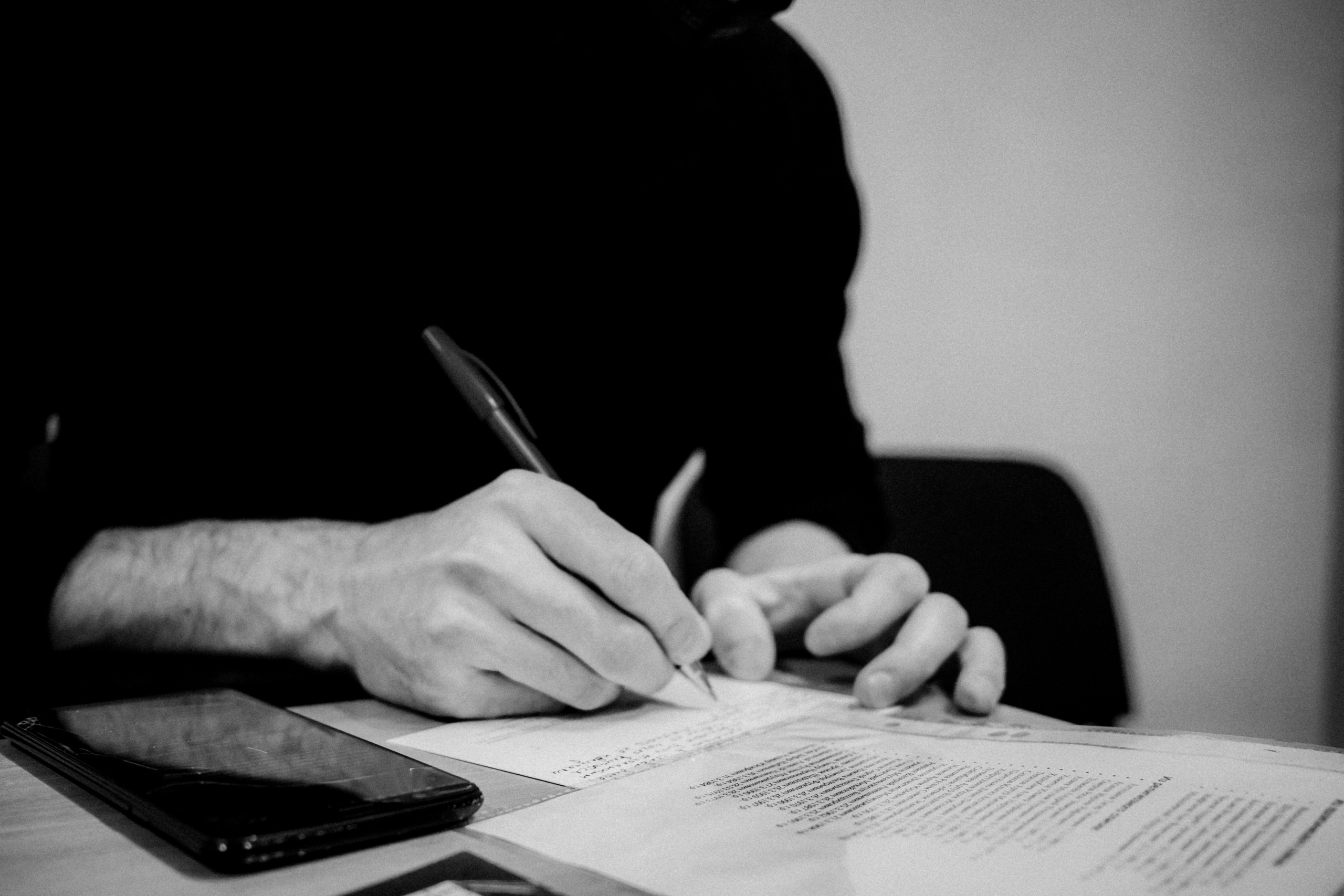 Signing postcards for political prisoners, February 2022. Photographer in Israel Alice Milchin