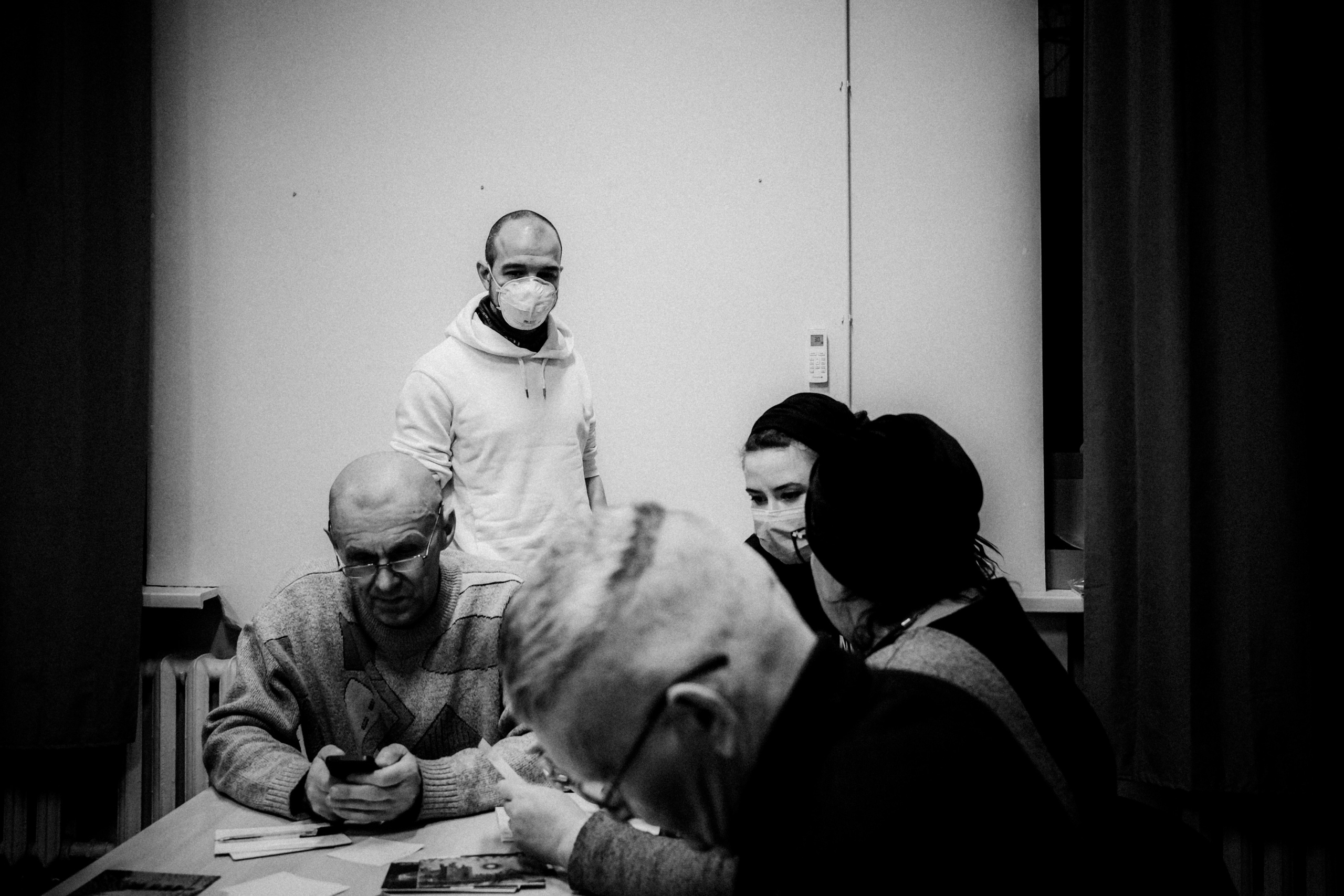 Signing postcards for political prisoners, February 2022. Photographer in Israel Alice Milchin