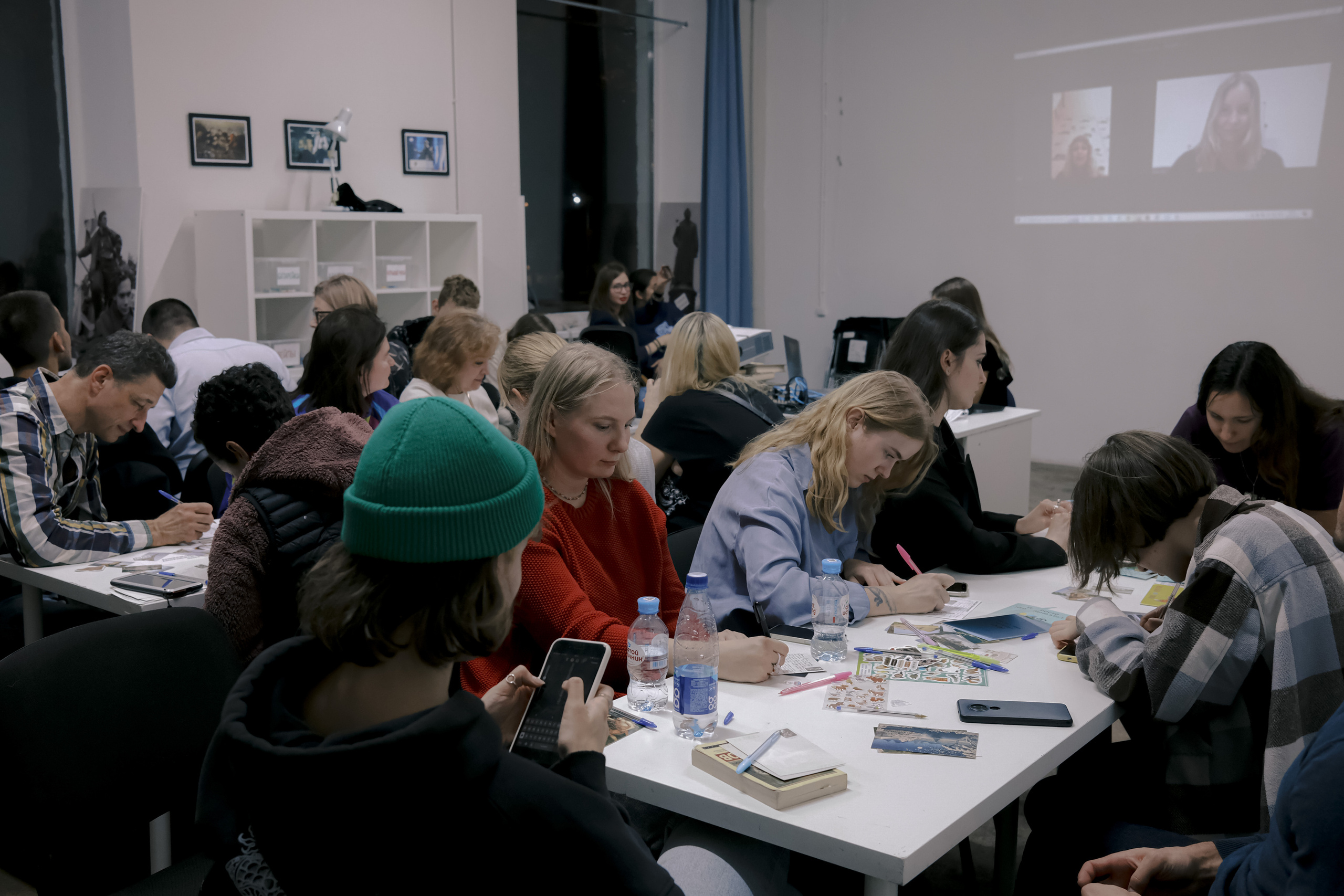 Signing postcards for political prisoners, September 2022. Photographer in Israel Alice Milchin