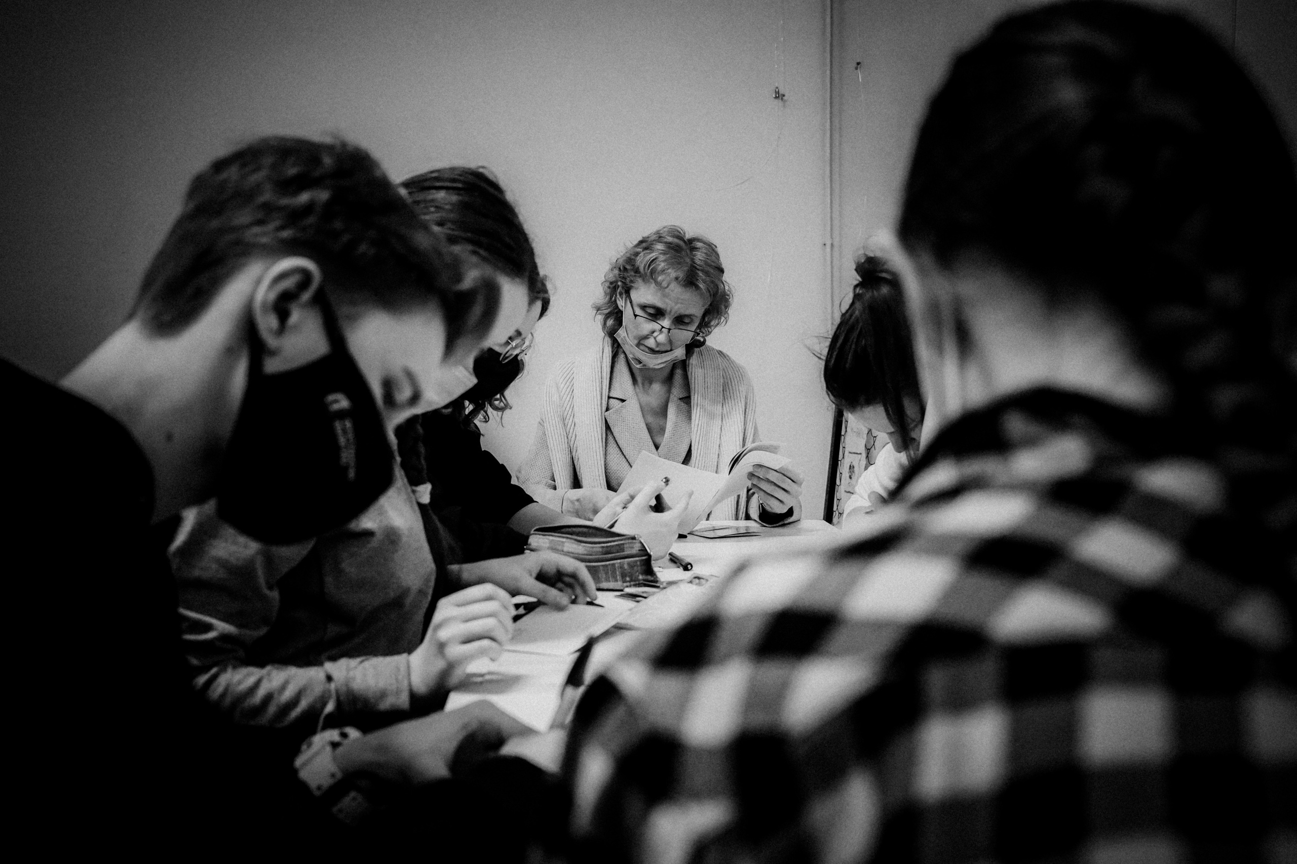 Signing postcards for political prisoners, February 2022. Photographer in Israel Alice Milchin