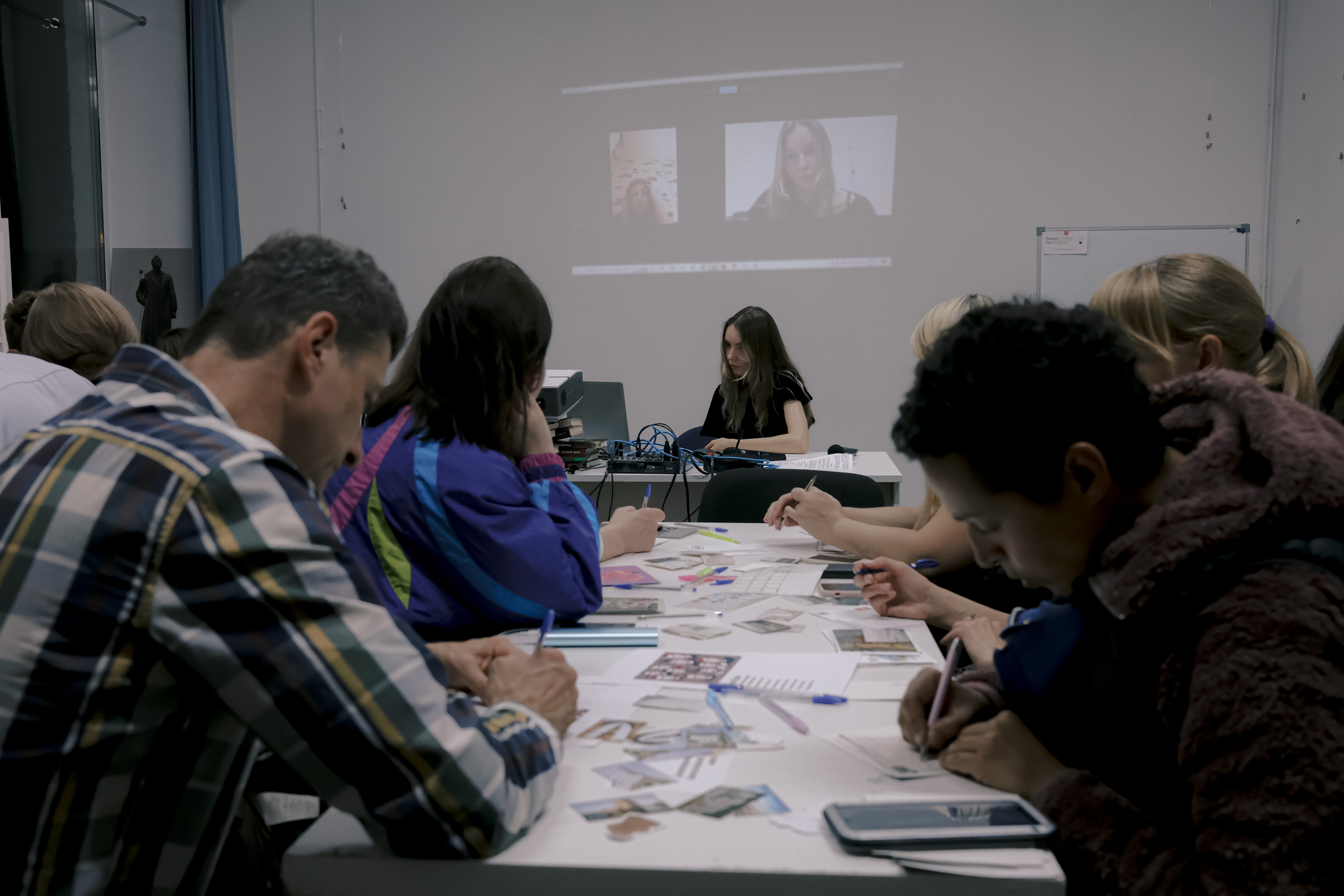 Signing postcards for political prisoners, September 2022. Photographer in Israel Alice Milchin