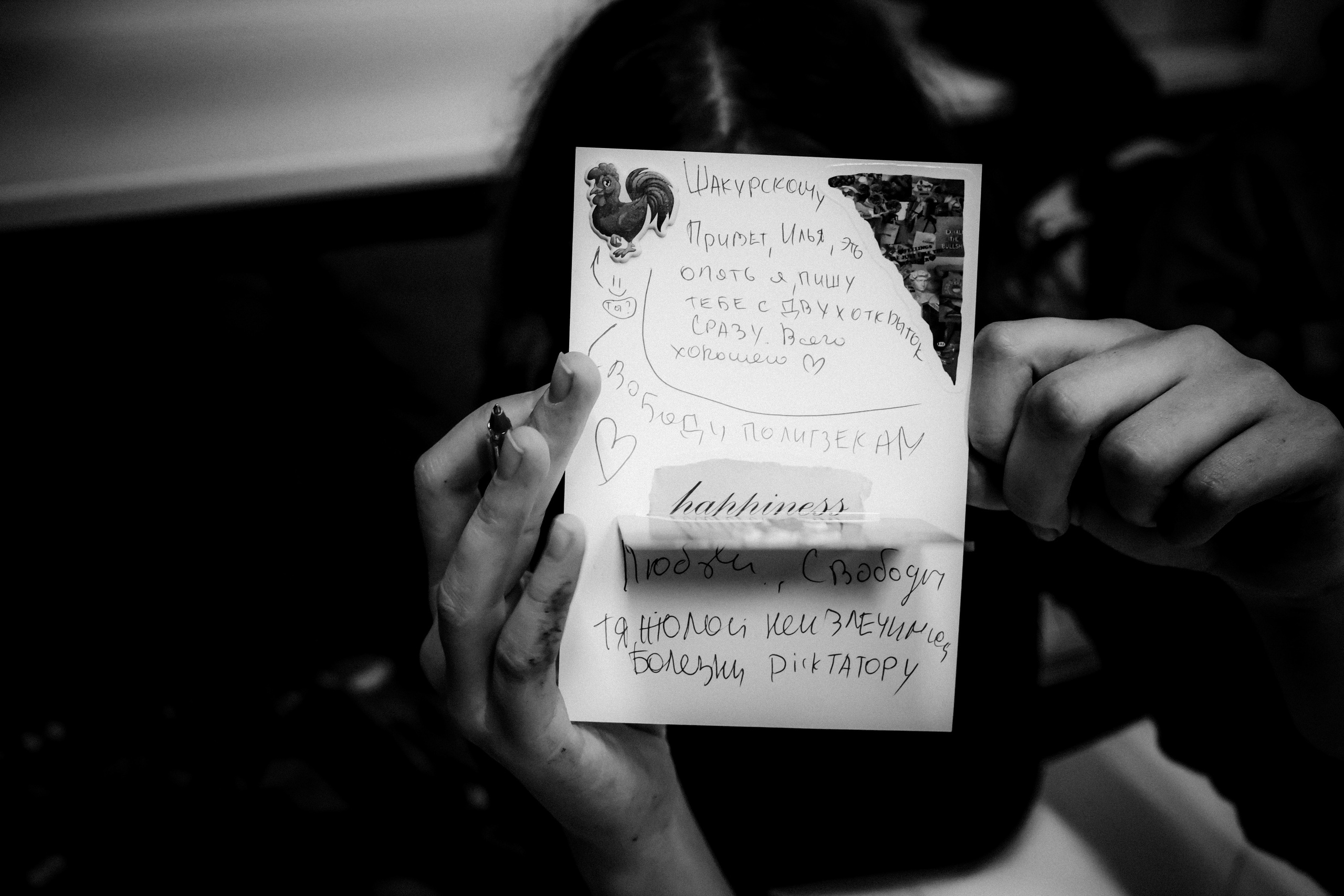 Signing postcards for political prisoners, September 2022. Photographer in Israel Alice Milchin