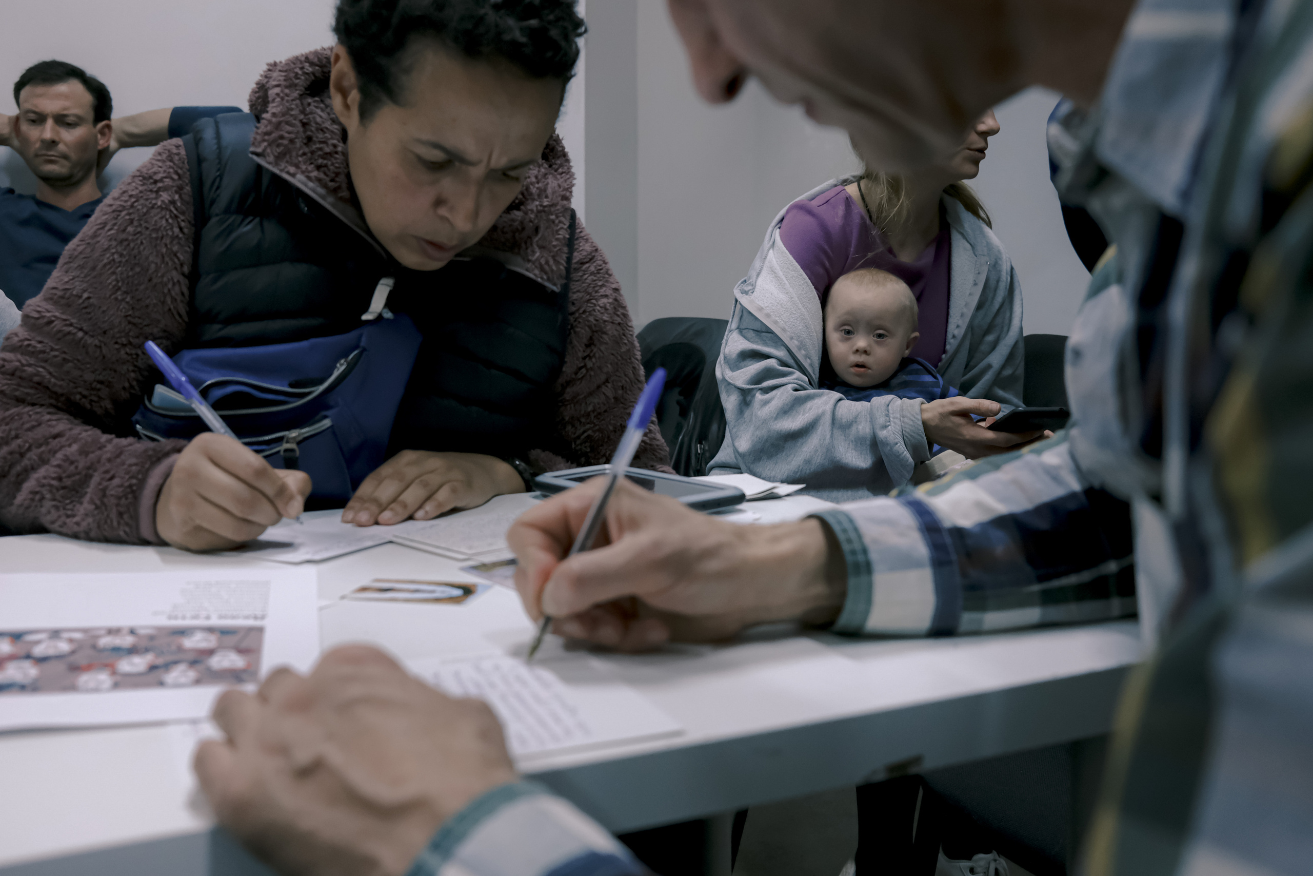 Signing postcards for political prisoners, September 2022. Photographer in Israel Alice Milchin