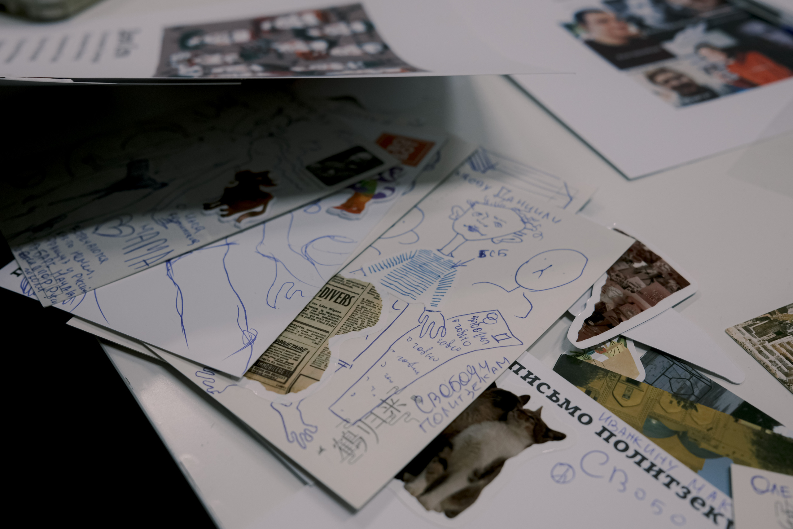 Signing postcards for political prisoners, September 2022. Photographer in Israel Alice Milchin