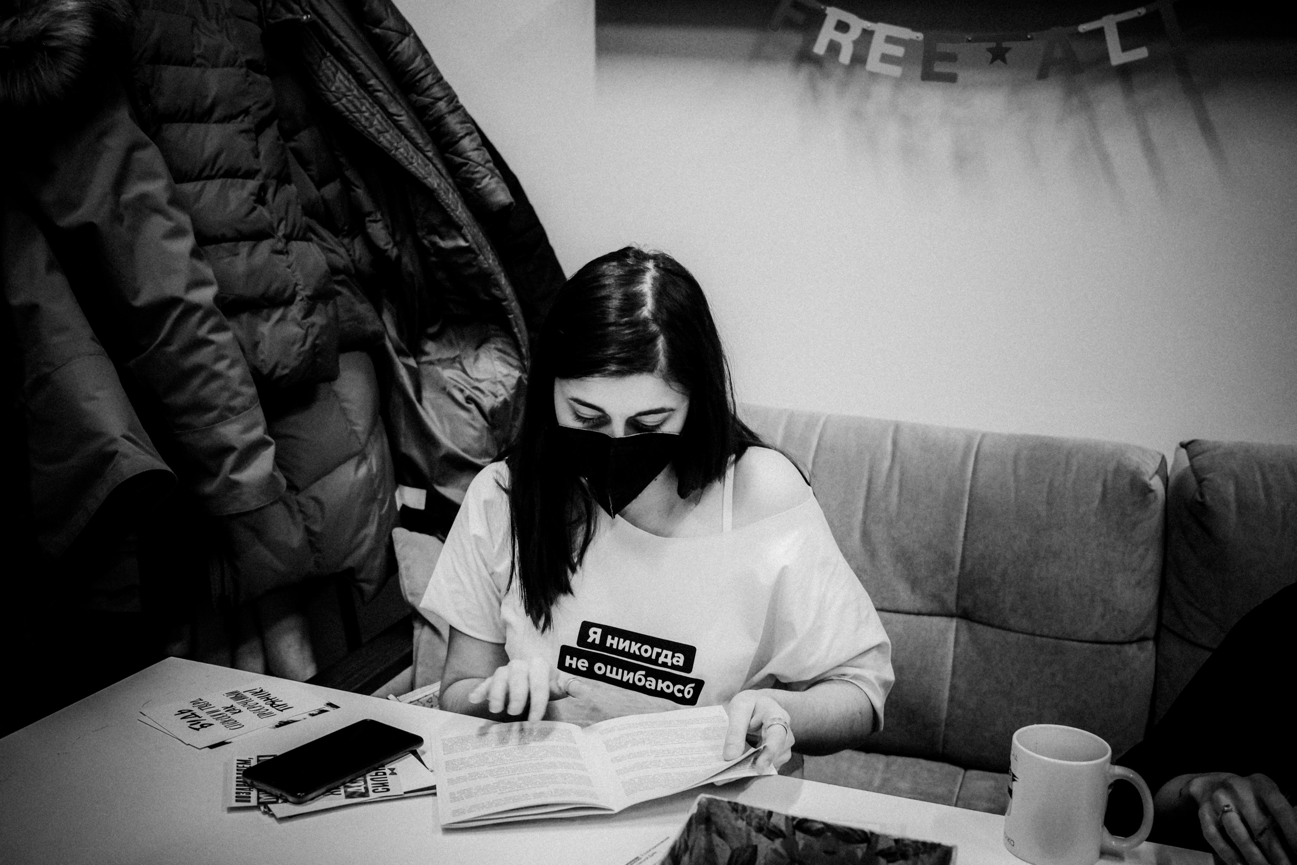 Signing postcards for political prisoners, February 2022. Photographer in Israel Alice Milchin