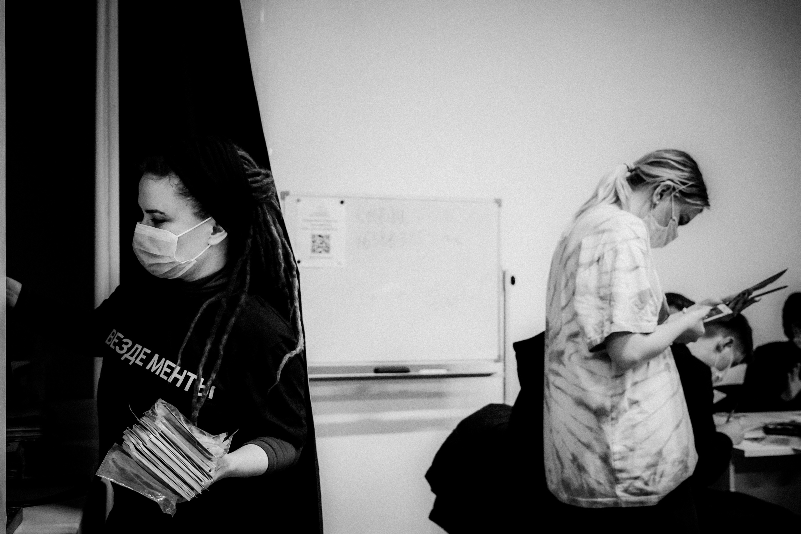 Signing postcards for political prisoners, February 2022. Photographer in Israel Alice Milchin