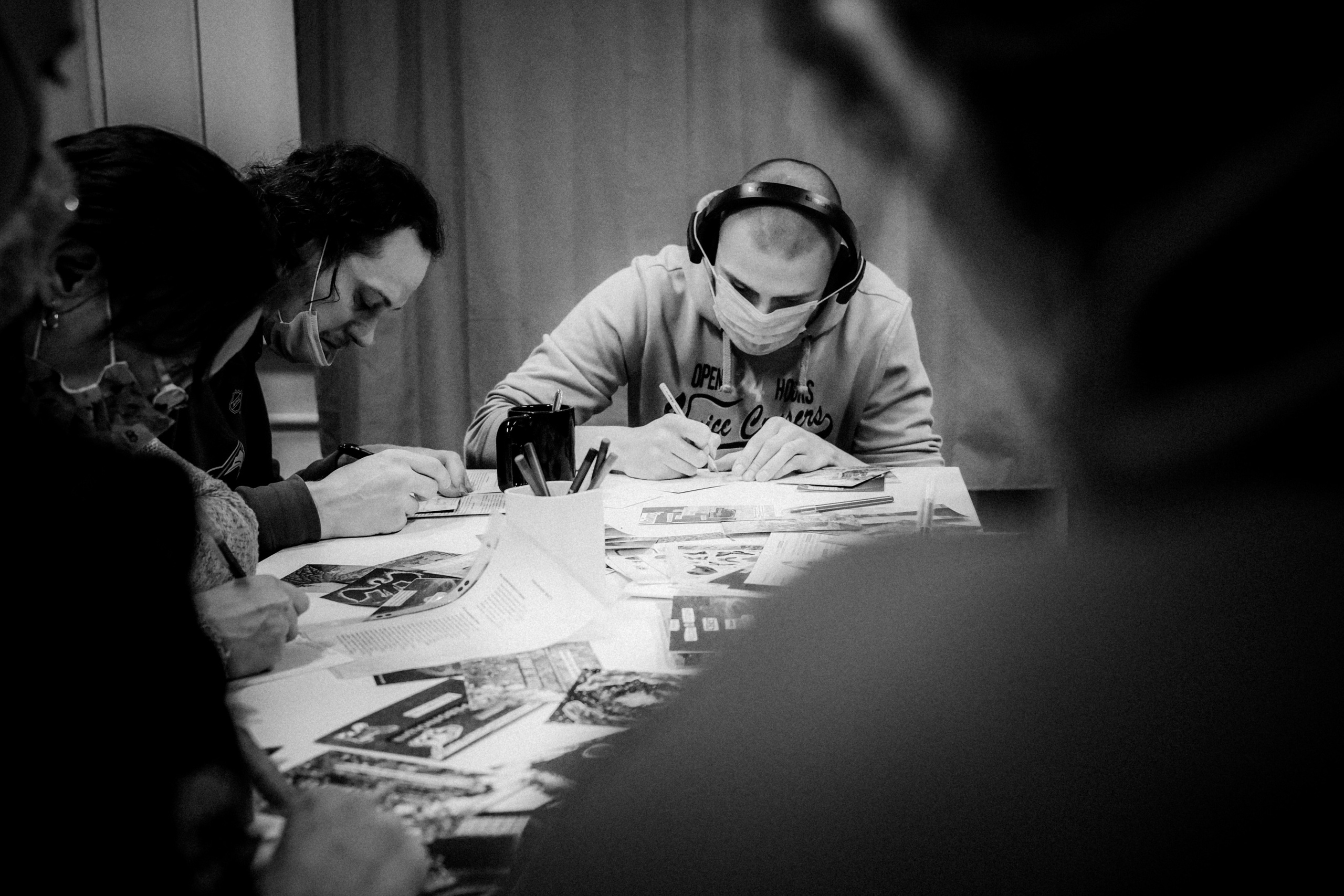 Signing postcards for political prisoners, February 2022. Photographer in Israel Alice Milchin