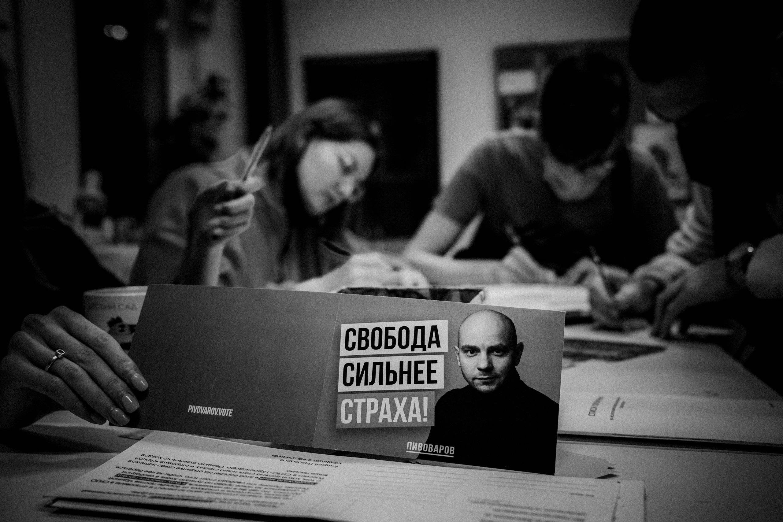 Signing postcards for political prisoners, February 2022. Photographer in Israel Alice Milchin