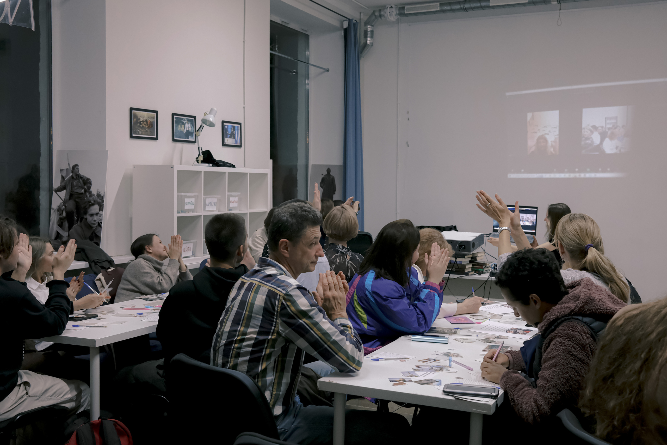Signing postcards for political prisoners, September 2022. Photographer in Israel Alice Milchin