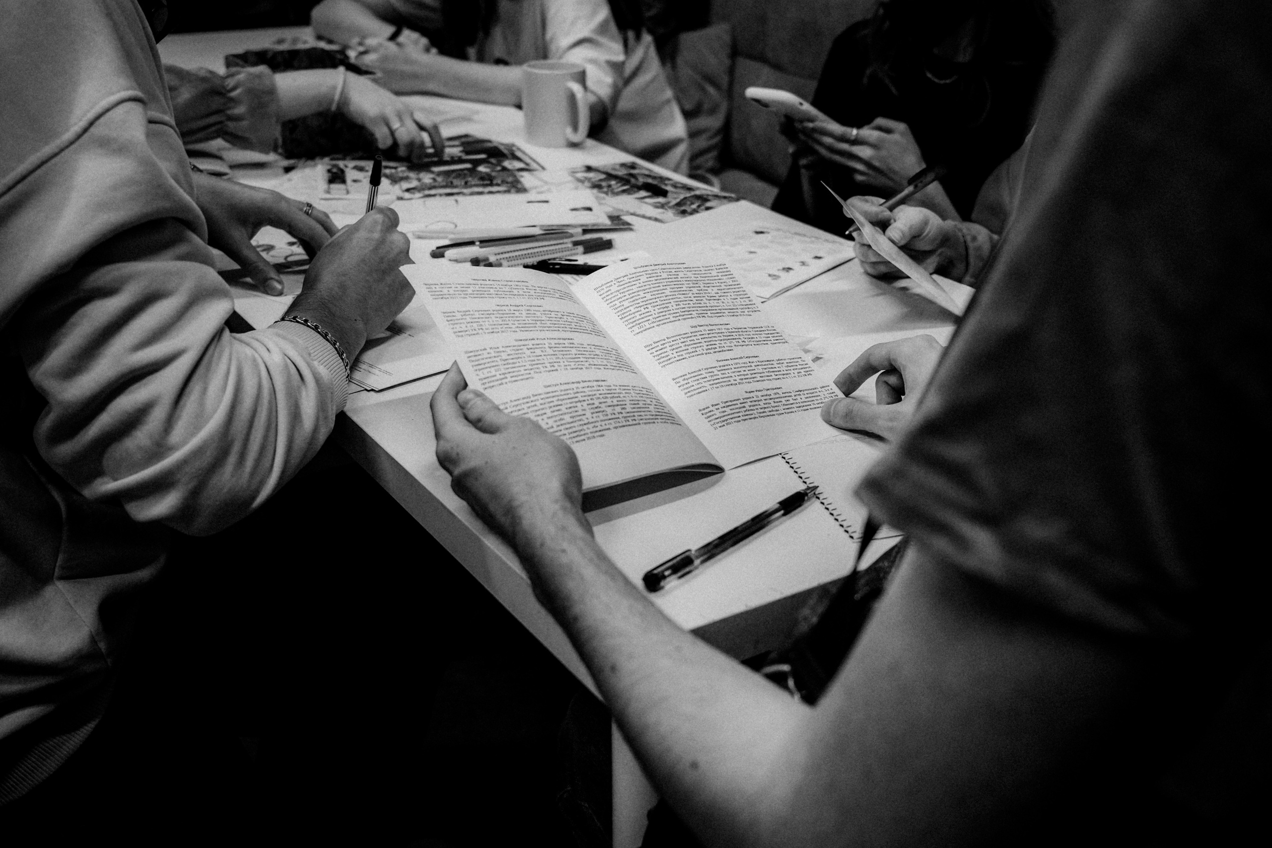Signing postcards for political prisoners, February 2022. Photographer in Israel Alice Milchin