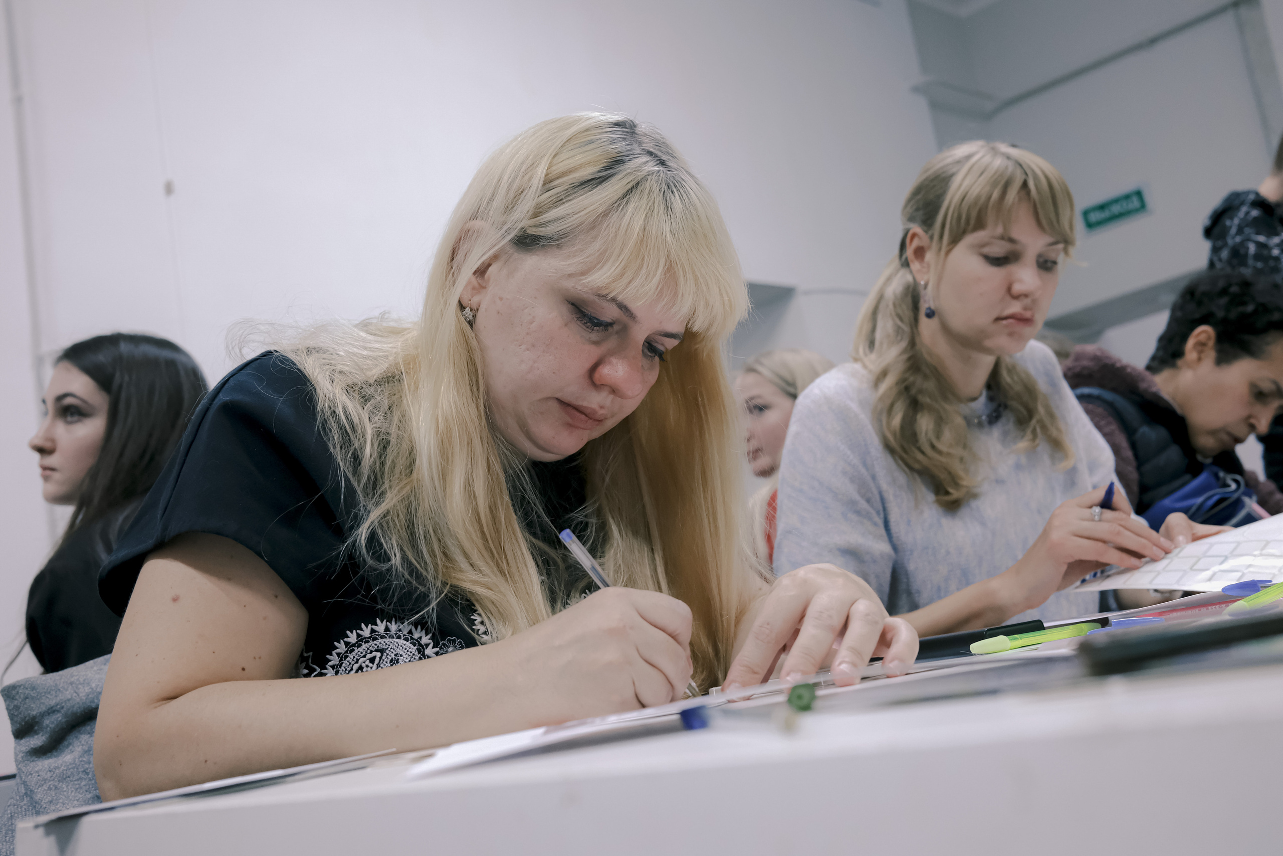 Signing postcards for political prisoners, September 2022. Photographer in Israel Alice Milchin