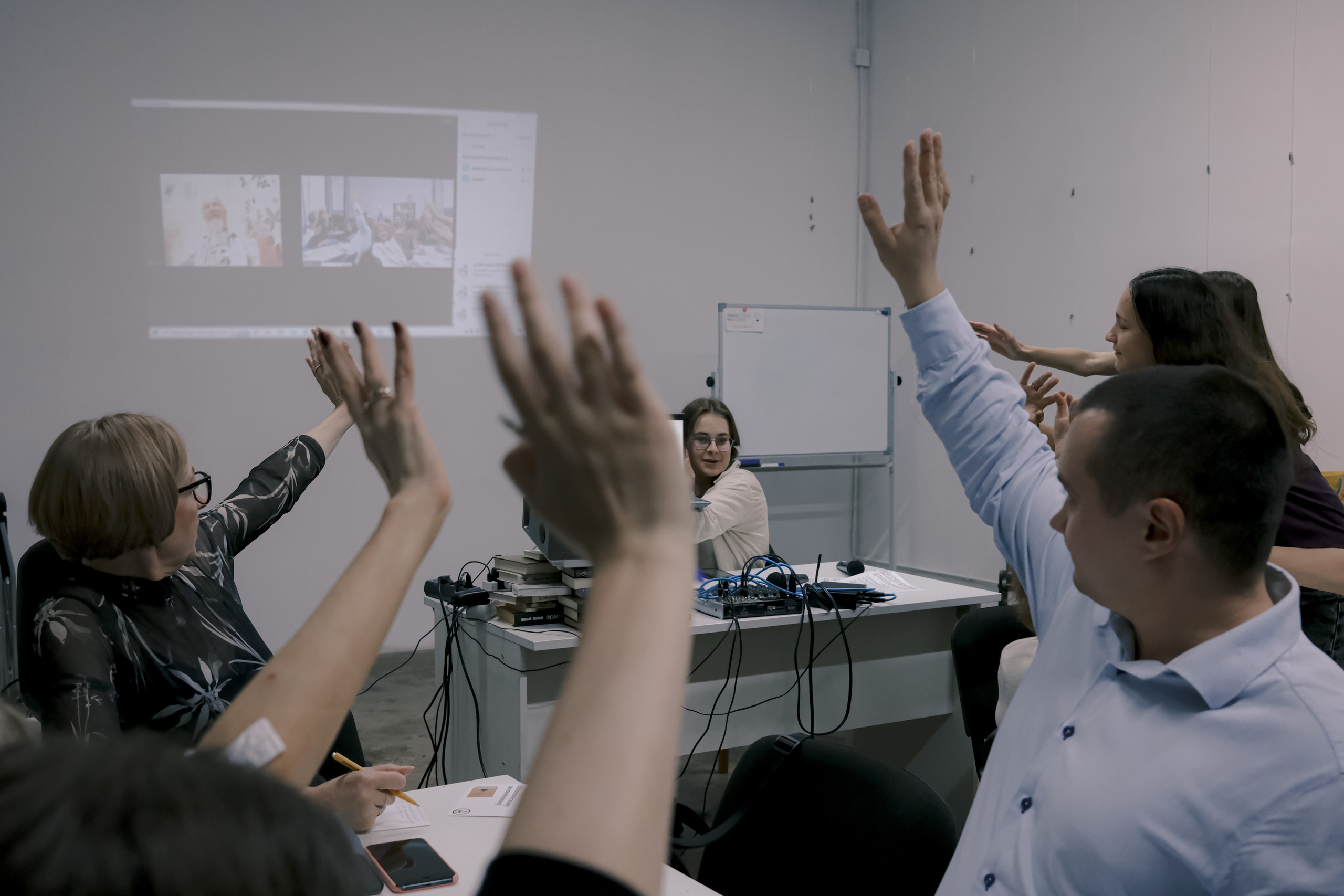 Signing postcards for political prisoners, September 2022. Photographer in Israel Alice Milchin