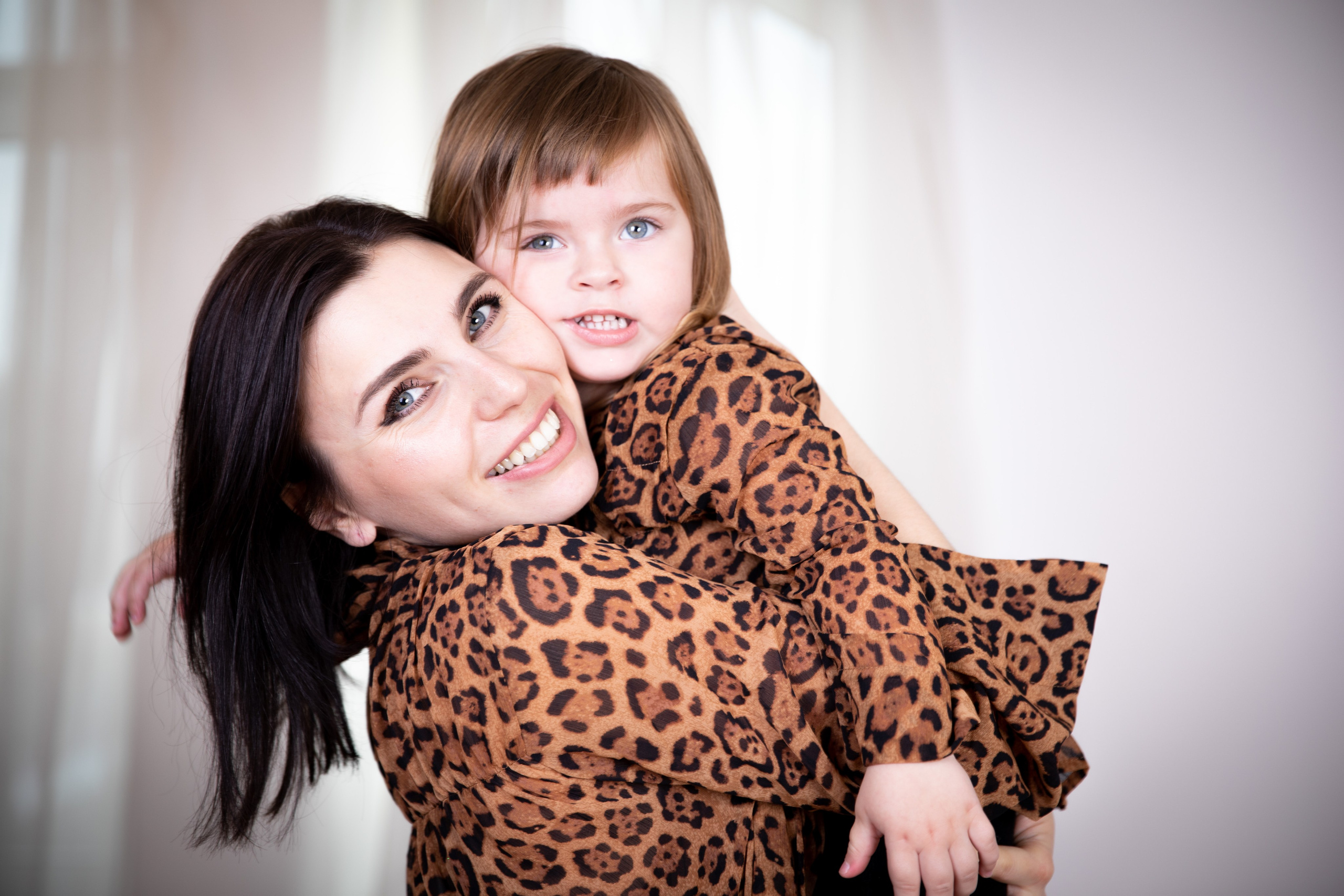 Mother and daughter at a studio photo shoot