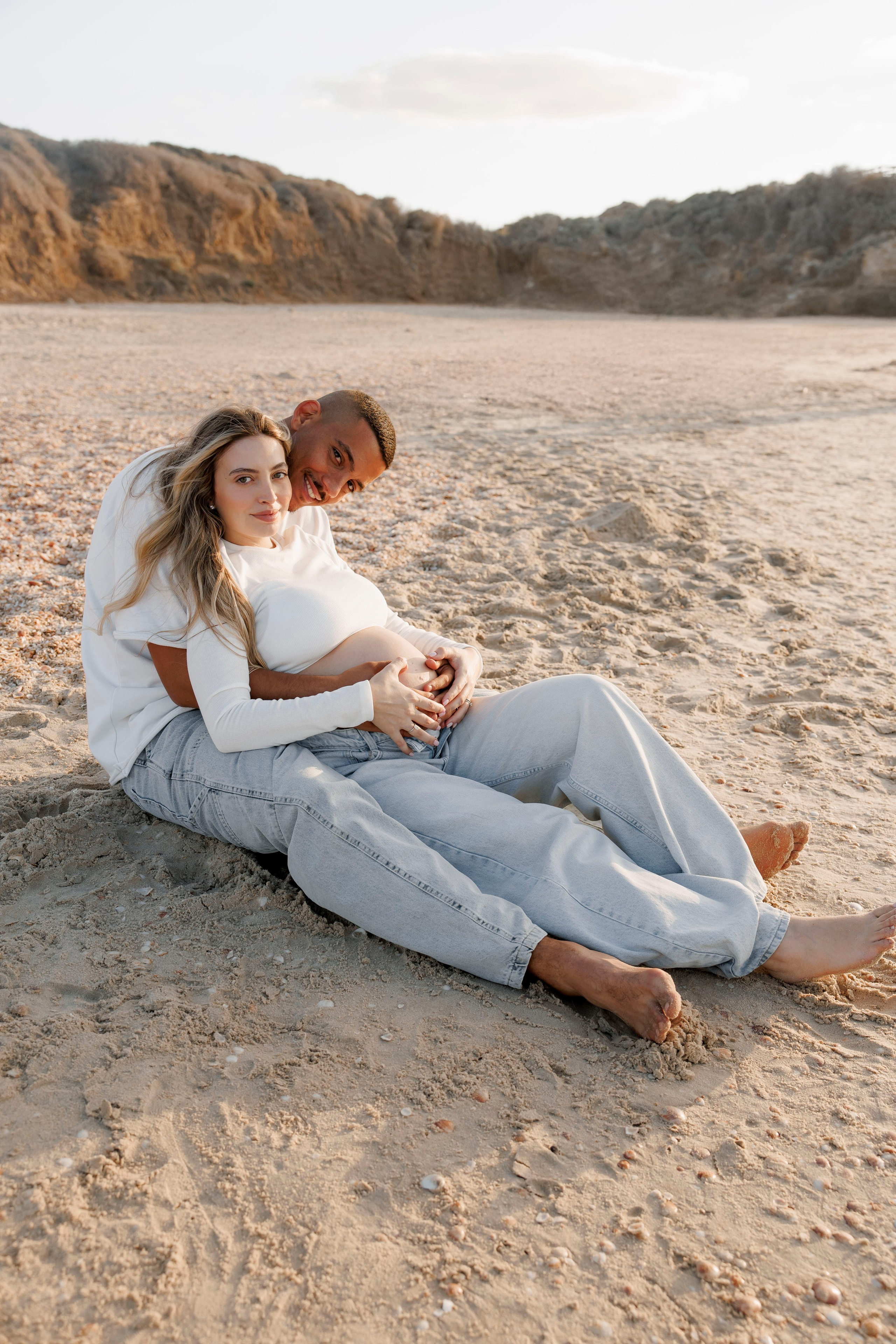 Pregnancy photoshoot near the sea. Wedding and family photographer