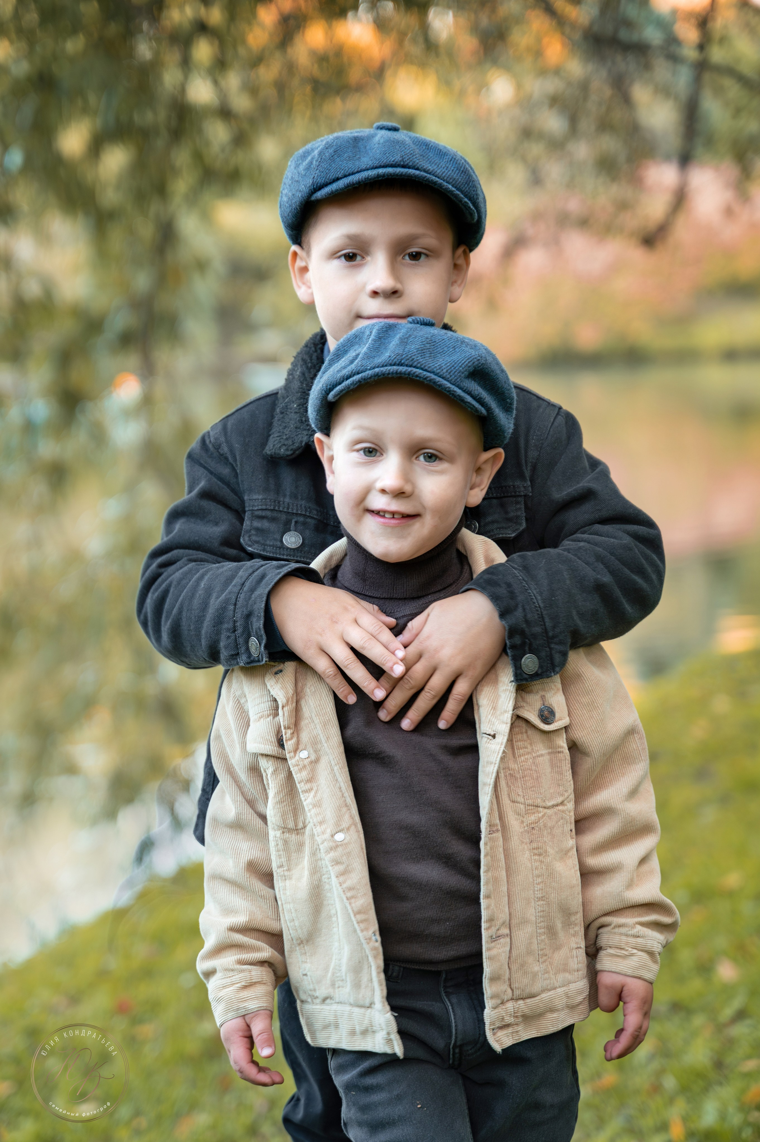 young-boys-matching-caps-park-portrait 