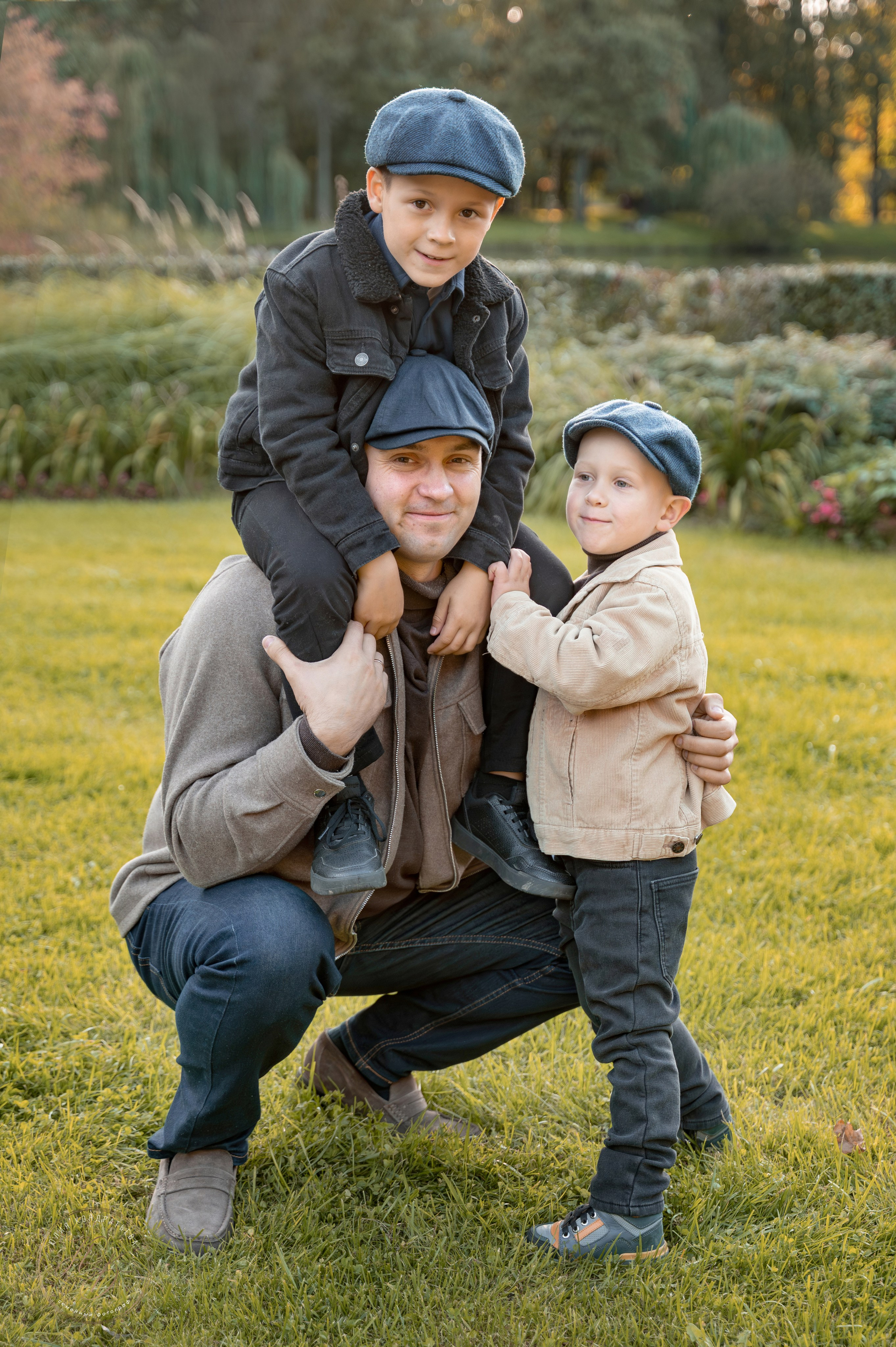father-with-two-sons-park-portrait