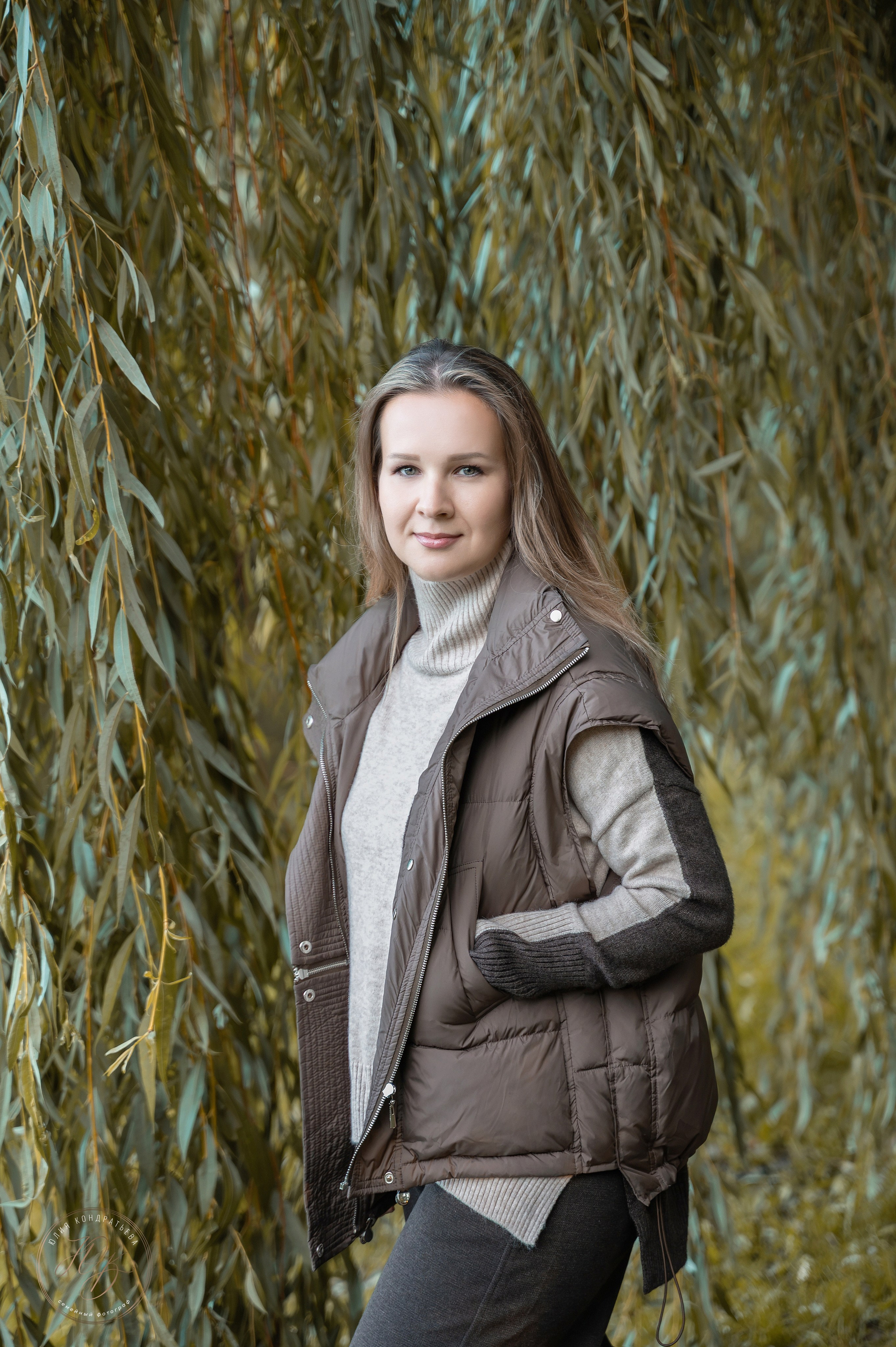 woman-in-warm-vest-willow-background