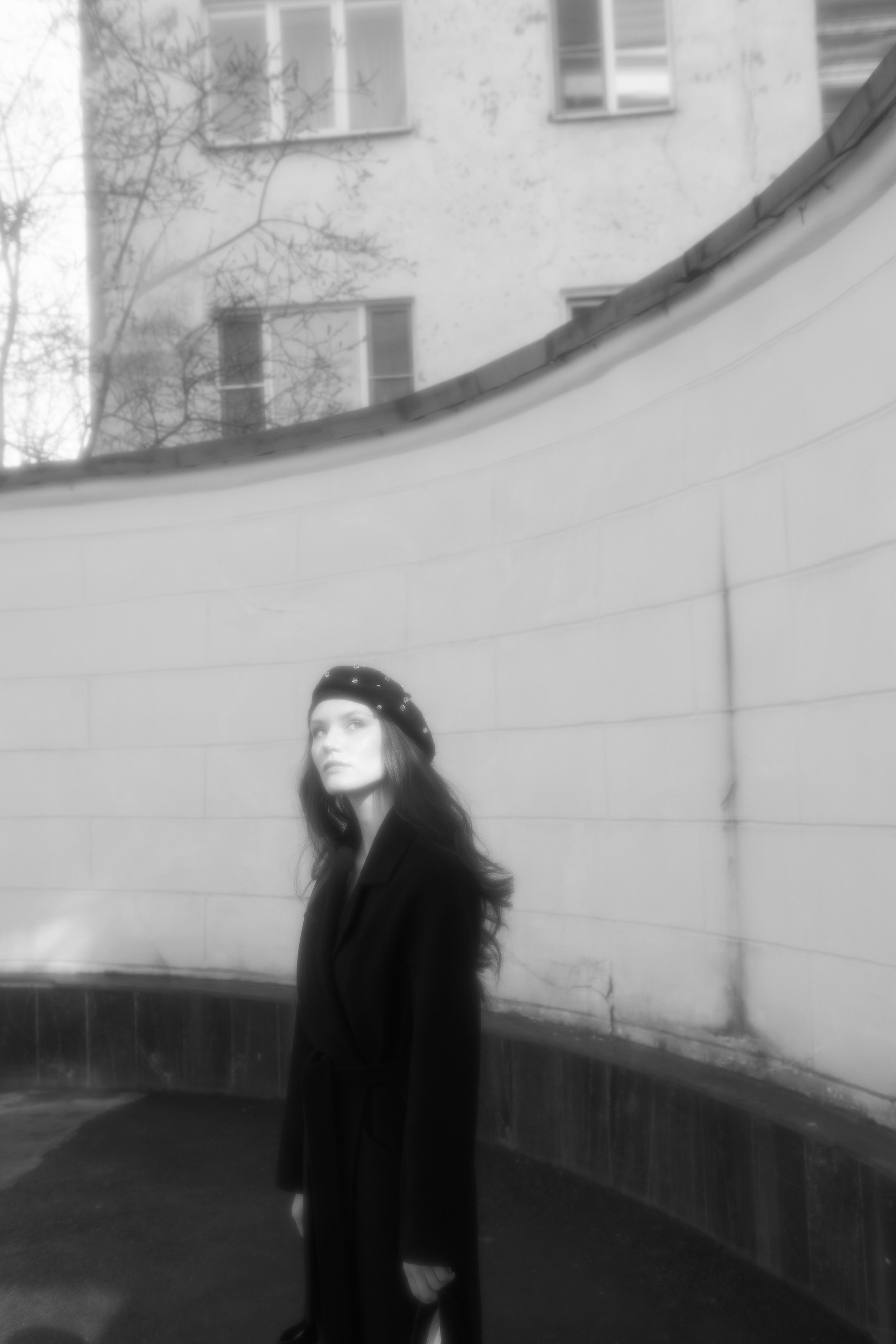Black coat walking. Fashion Photographer Oxana Chernomorets