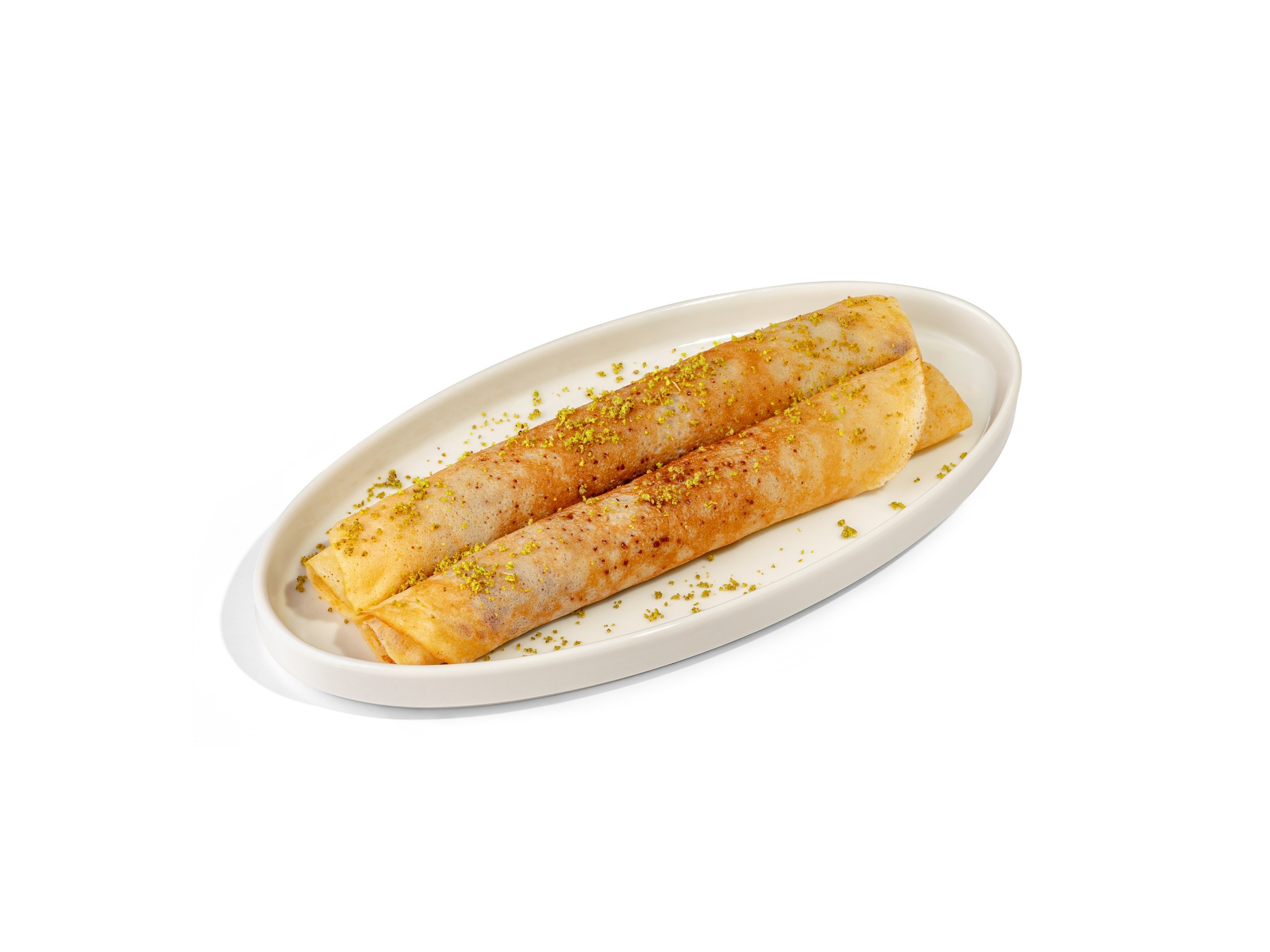 БЛИНЫ С НУТЕЛЛОЙ И ФИСТАШКОЙ  — 850Р. Блины с начинкой из шоколадно - ореховой пасты и хрустящего теста катаифи. Украшаются молотой фисташкой. 