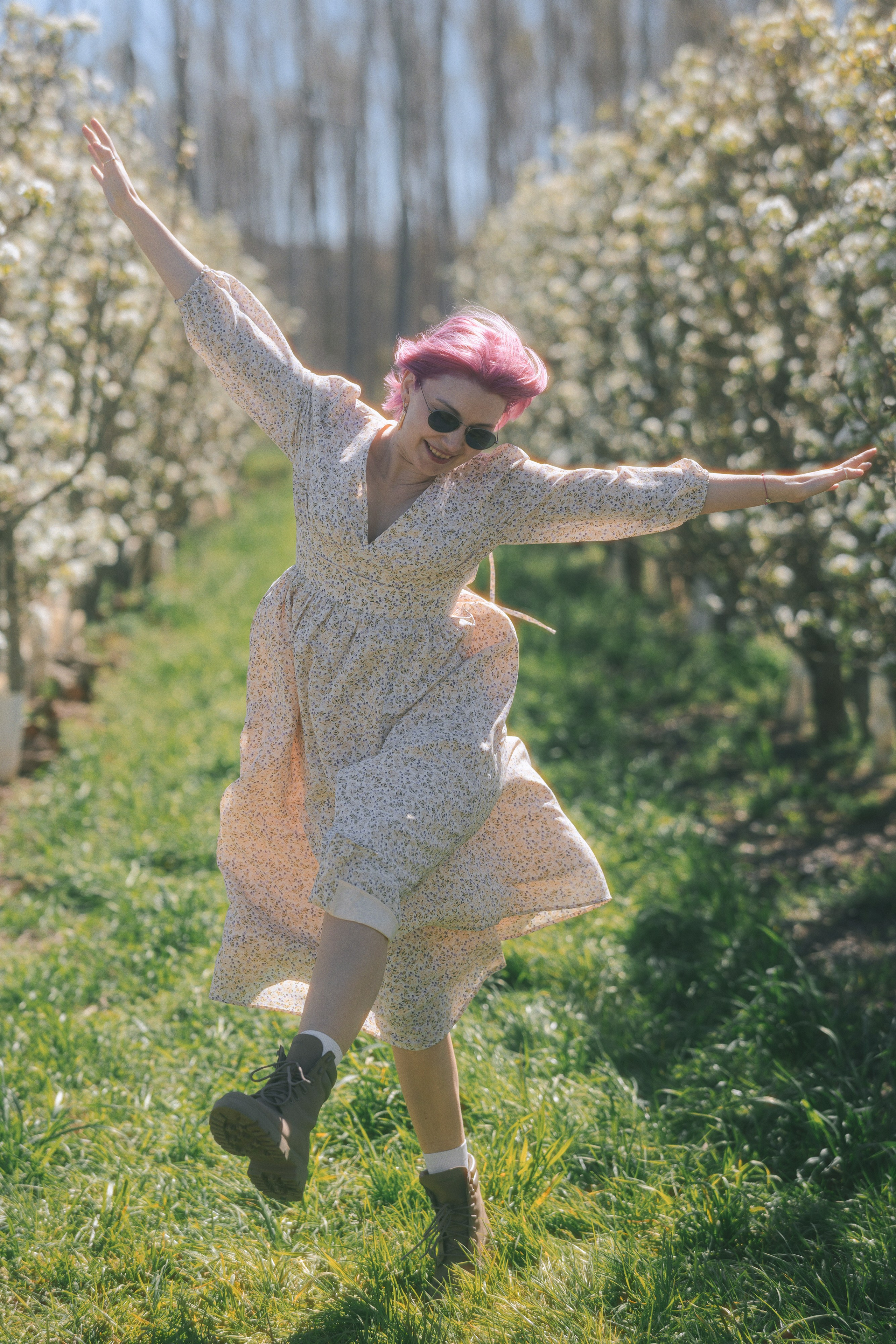 Outdoor portrait of a woman in a floral garden in Barcelona, natural light photoshoot