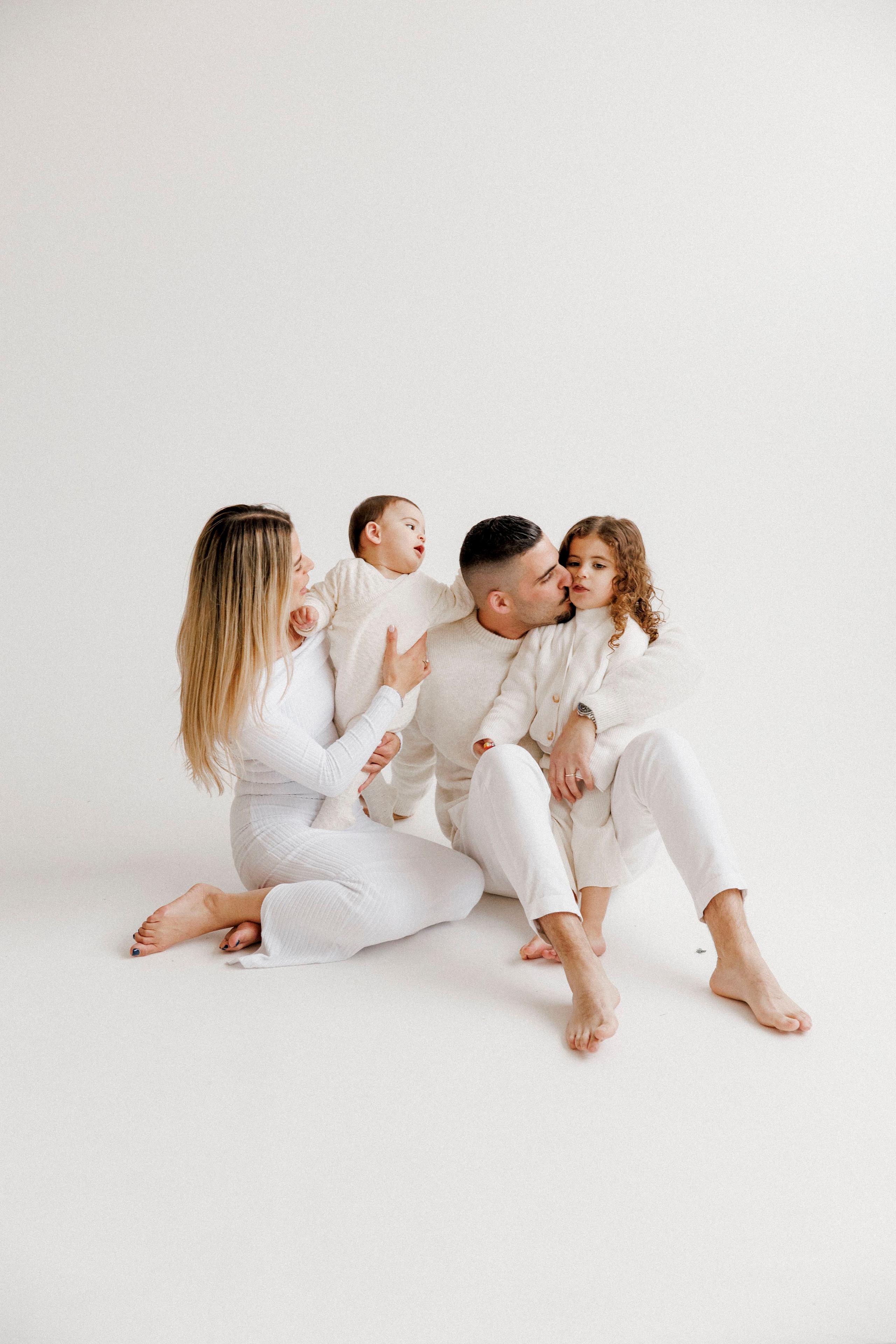 Family photoshoot in White Studio. Wedding and family photographer
