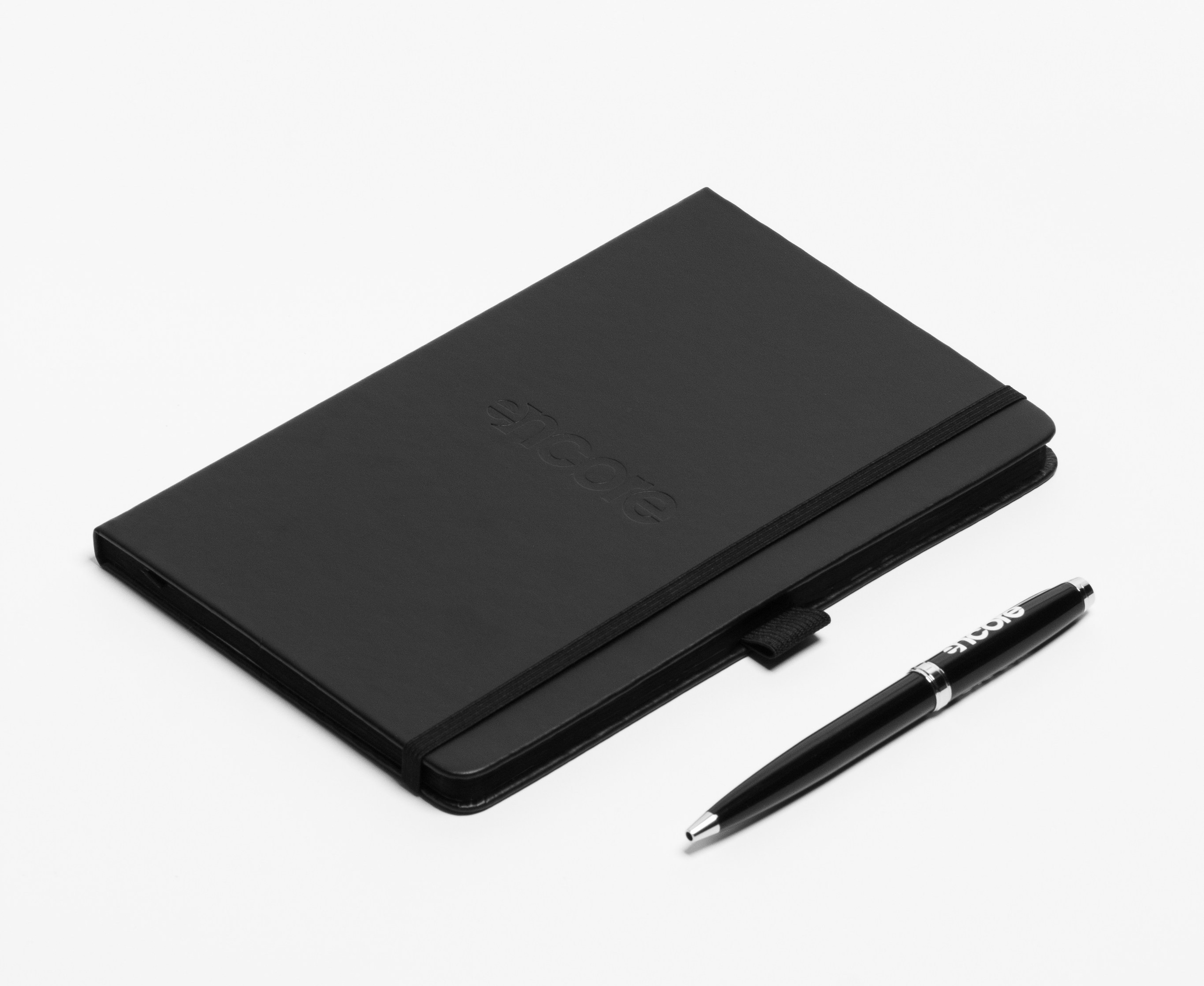 Catalog product photography Tbilisi — notebook and pen on white background