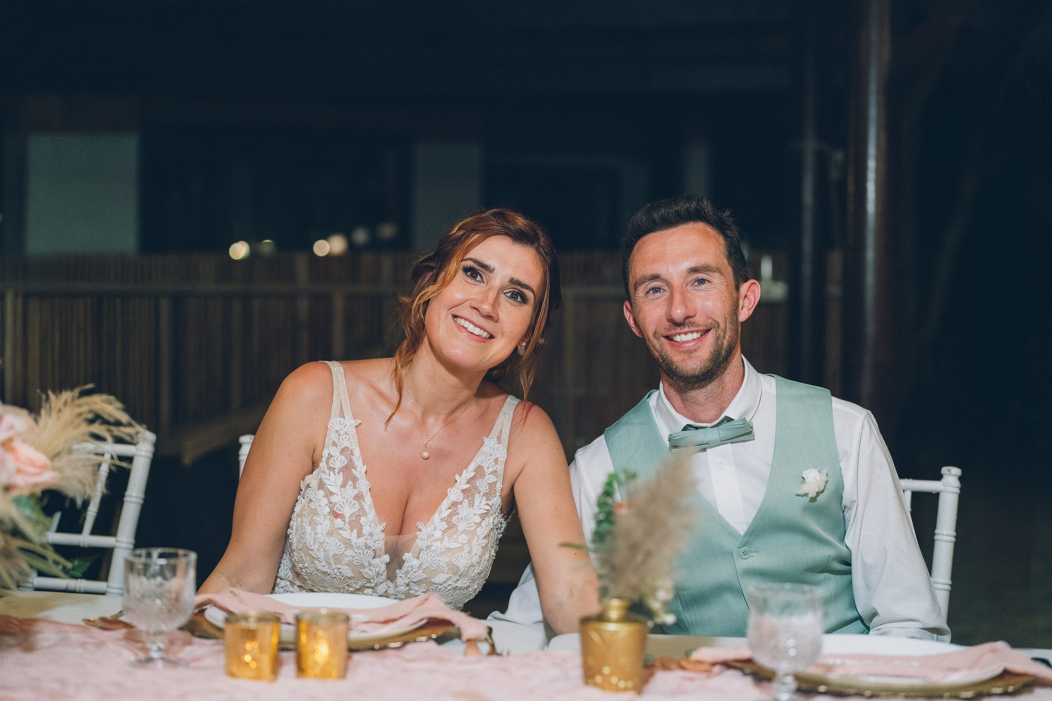 Wedding celebration with guests on a tropical sunset beach in Koh Samui